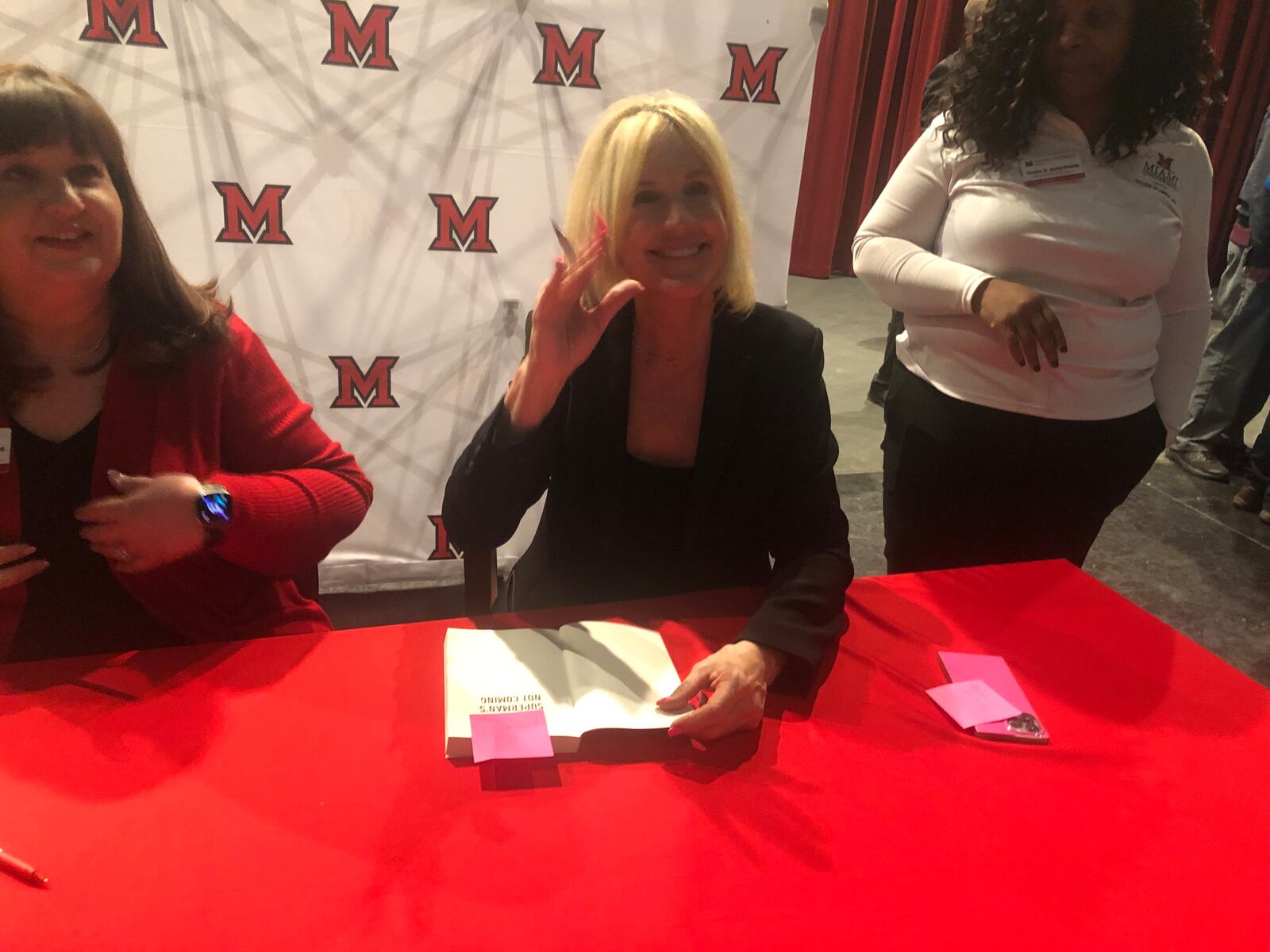 After her speaking engagement Thursday night at Miami University Middletown, activist Erin Brockovich signed copies of her second book, "Superman's Not Coming." RICK McCRABB/STAFF