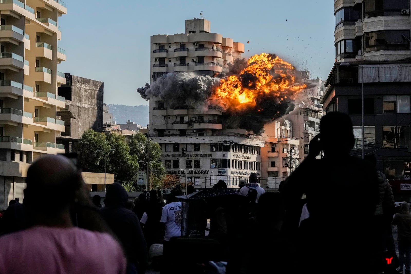 Smoke and flames erupt from a building hit by an Israeli airstrike in Chiyah, southern suburb of Beirut, Lebanon, Friday, Nov. 22, 2024. (AP Photo/Bilal Hussein)