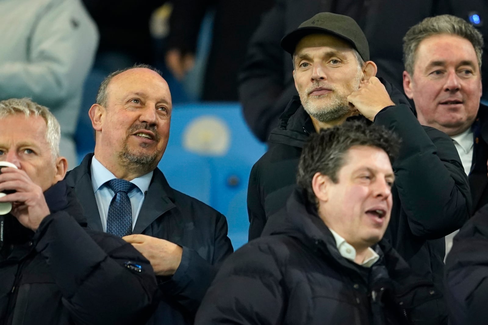 England manager Thomas Tuchel talks to Rafael Benitez before the start of the Champions League playoff first leg soccer match between Manchester City and Real Madrid at the Etihad Stadium in Manchester, England, Tuesday, Feb. 11, 2025. (AP Photo/Dave Thompson)