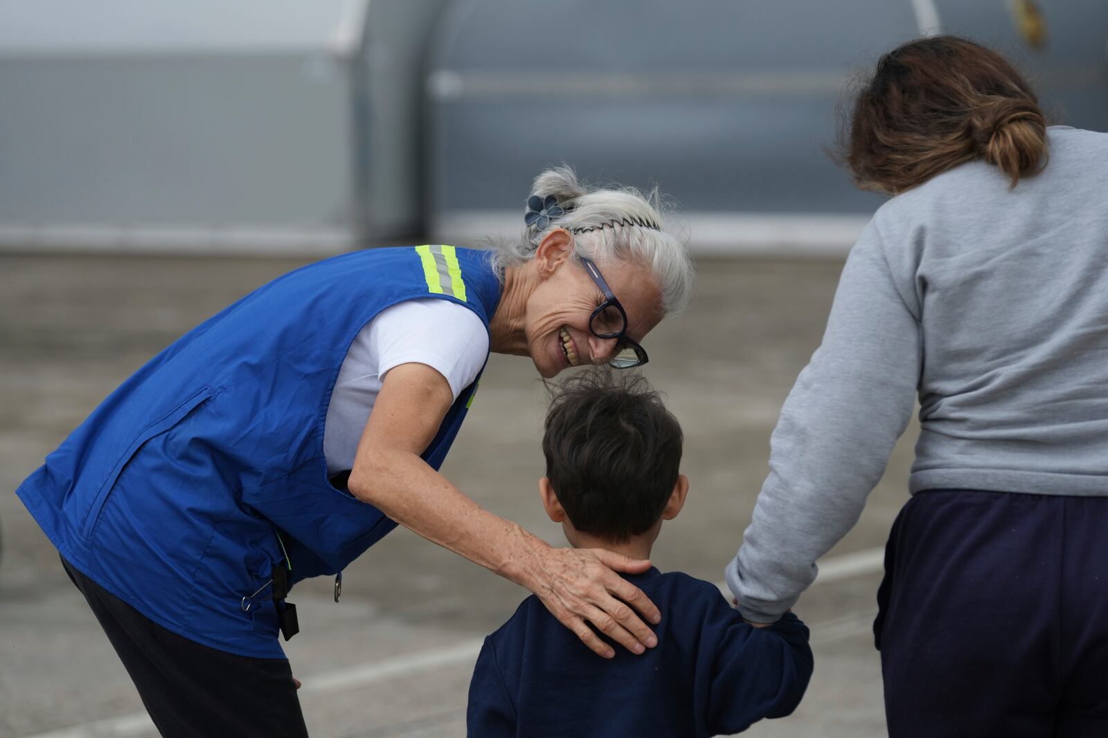 Idalina Bordignon, a nun with Scalabrinian Missionaries, greets a Honduran migrant who was deported from the U.S., at Ramon Villeda Morales Airport, in San Pedro Sula, Honduras, Wednesday, Dec. 4, 2024. (AP Photo/Moises Castillo)