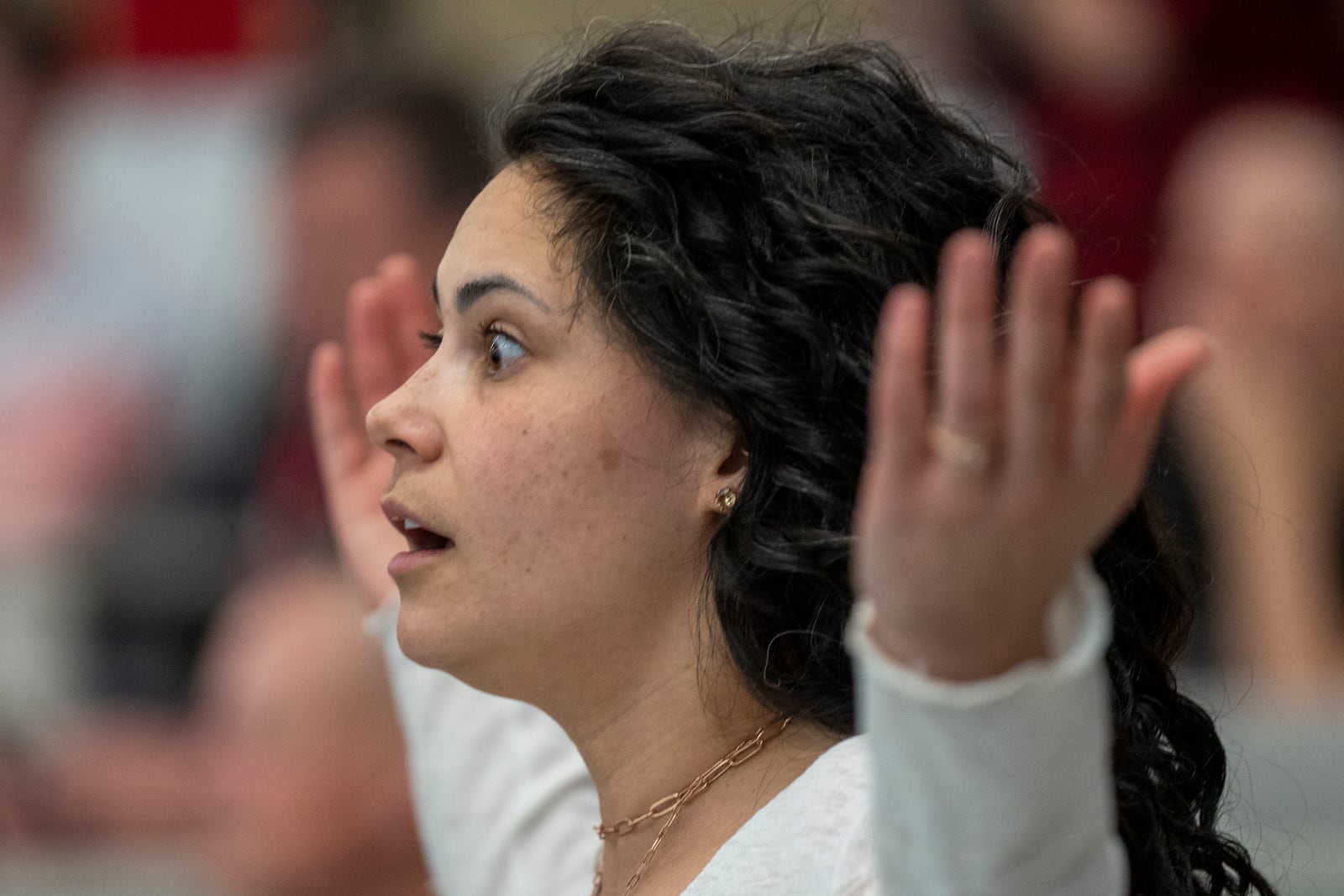 Megan Allen listens to Reps. Celeste Maloy and Mike Kennedy, R-Utah, during a GOP town hall meeting Thursday, March 20, 2025, in Salt Lake City. (AP Photo/Rick Egan)