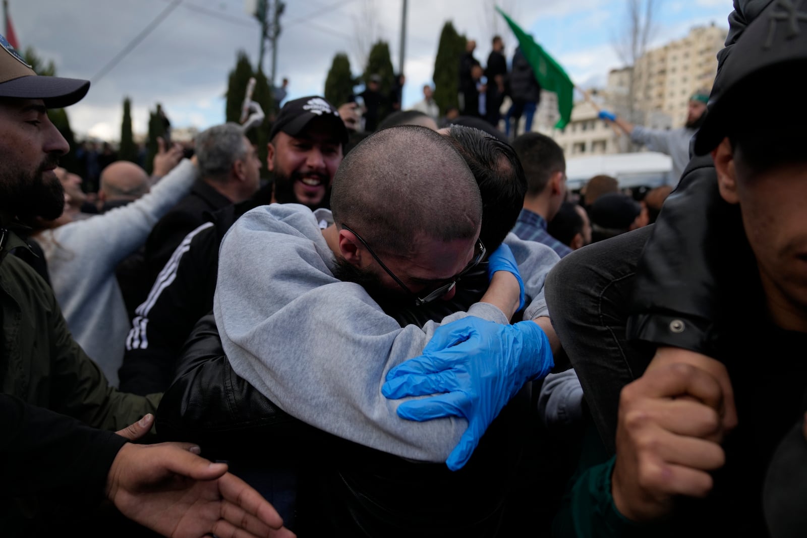 Palestinian prisoners are greeted by a crowd after being released from Israeli prison following a ceasefire agreement with Israel, in the West Bank city of Ramallah, Saturday, Jan. 25, 2025. (AP Photo/Nasser Nasser)