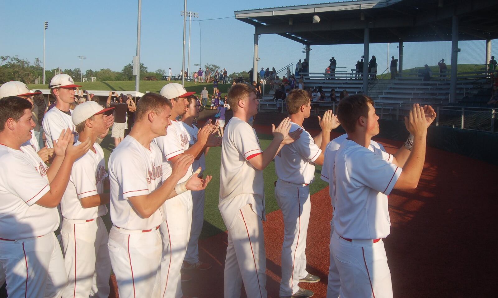 Carlisle’s players show their appreciation for their fans Friday after losing 2-1 to Cincinnati Hills Christian Academy in a Division III regional final at the Athletes in Action complex in Xenia. CONTRIBUTED PHOTO BY JOHN CUMMINGS