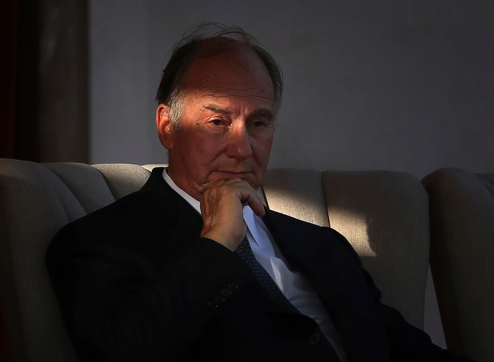 FILE - The Aga Khan, spiritual head of Ismaili Muslims, listens to a speech during the inauguration of the restored 16th century Humayun's Tomb in New Delhi, India, Sept. 18, 2013. (AP Photo/Manish Swarup, File)