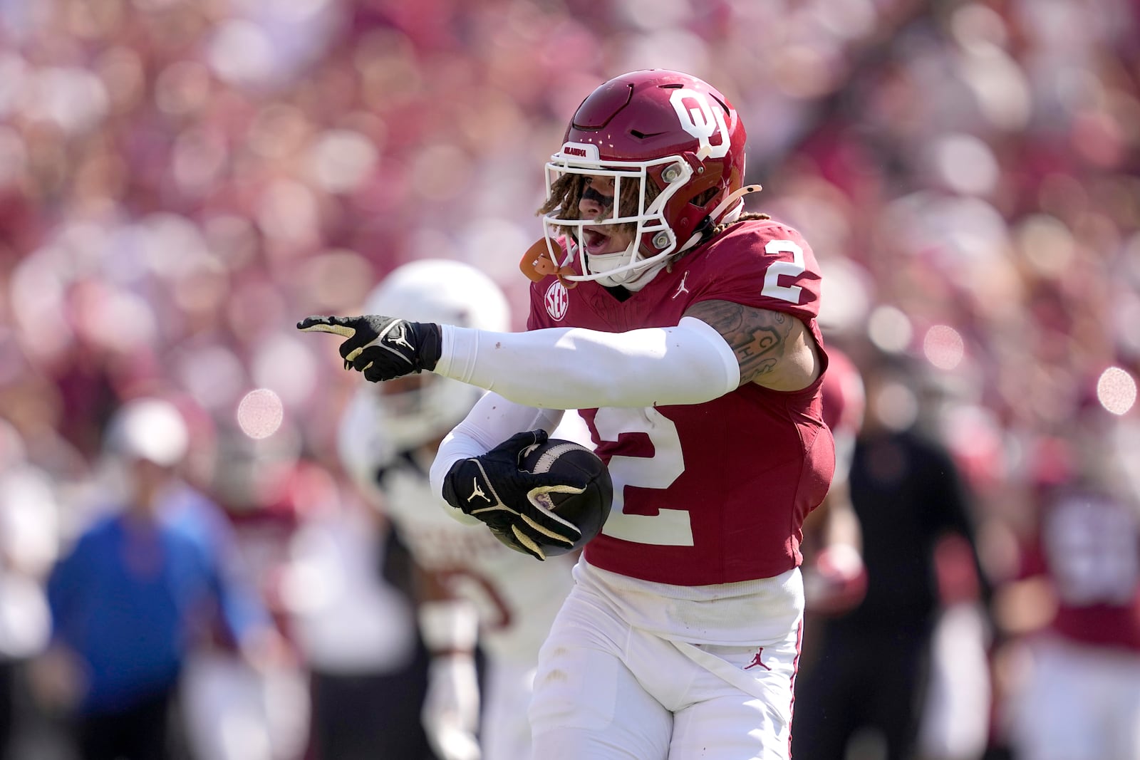 Oklahoma defensive back Billy Bowman Jr. (2) celebrates after intercepting a Texas pass in the first half of an NCAA college football game in Dallas, Saturday, Oct. 12, 2024. (AP Photo/Tony Gutierrez)