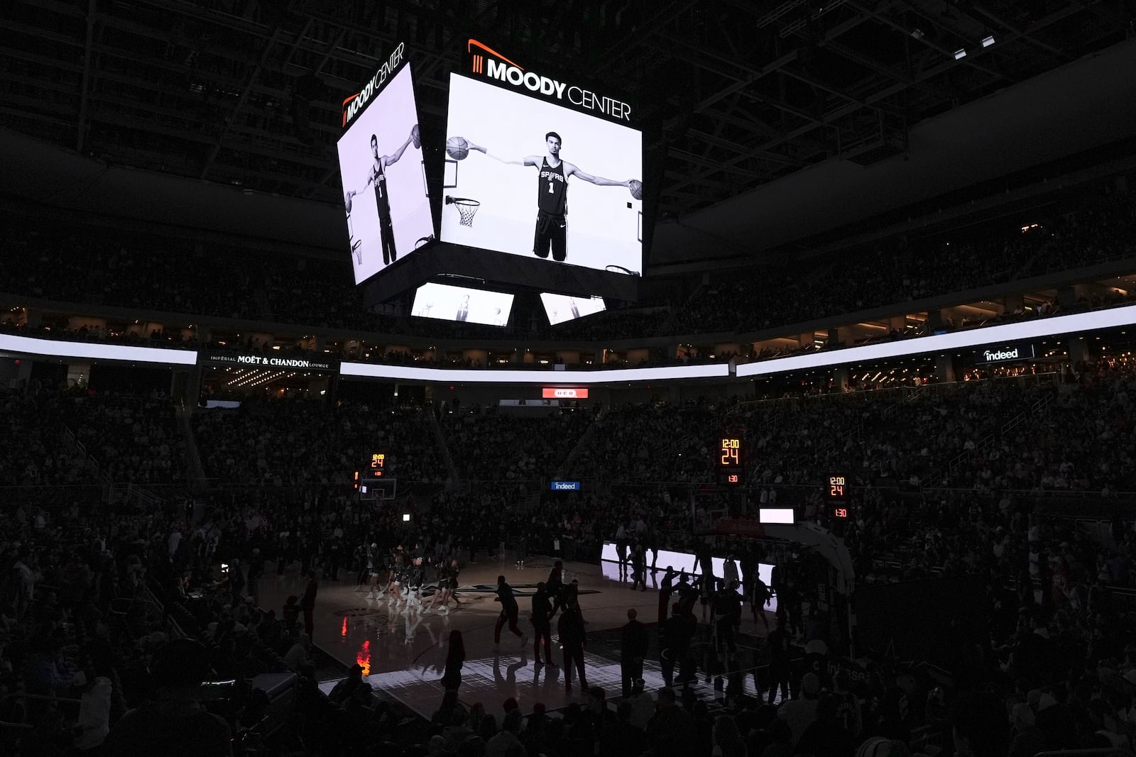 A photo of San Antonio Spurs center Victor Wembanyama is projected on the scoreboard before an NBA basketball game between the San Antonio Spurs and the Phoenix Suns in Austin, Texas, Thursday, Feb. 20, 2025. (AP Photo/Eric Gay)