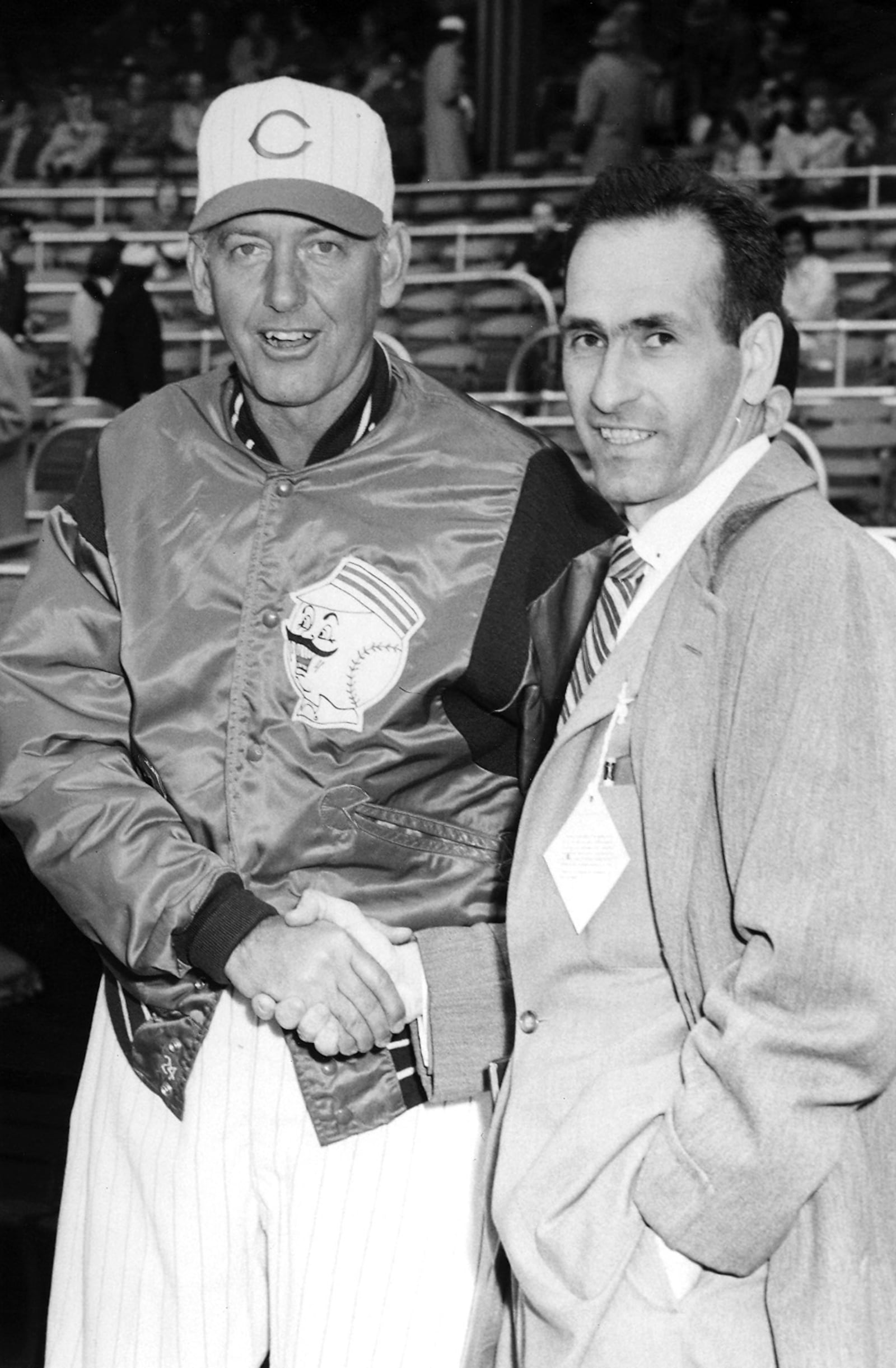 Jerry Nardiello, right, greets Mayo Smith, manager of the Cincinnati Reds, before the 1959 Opening Day game at Crosley Field.