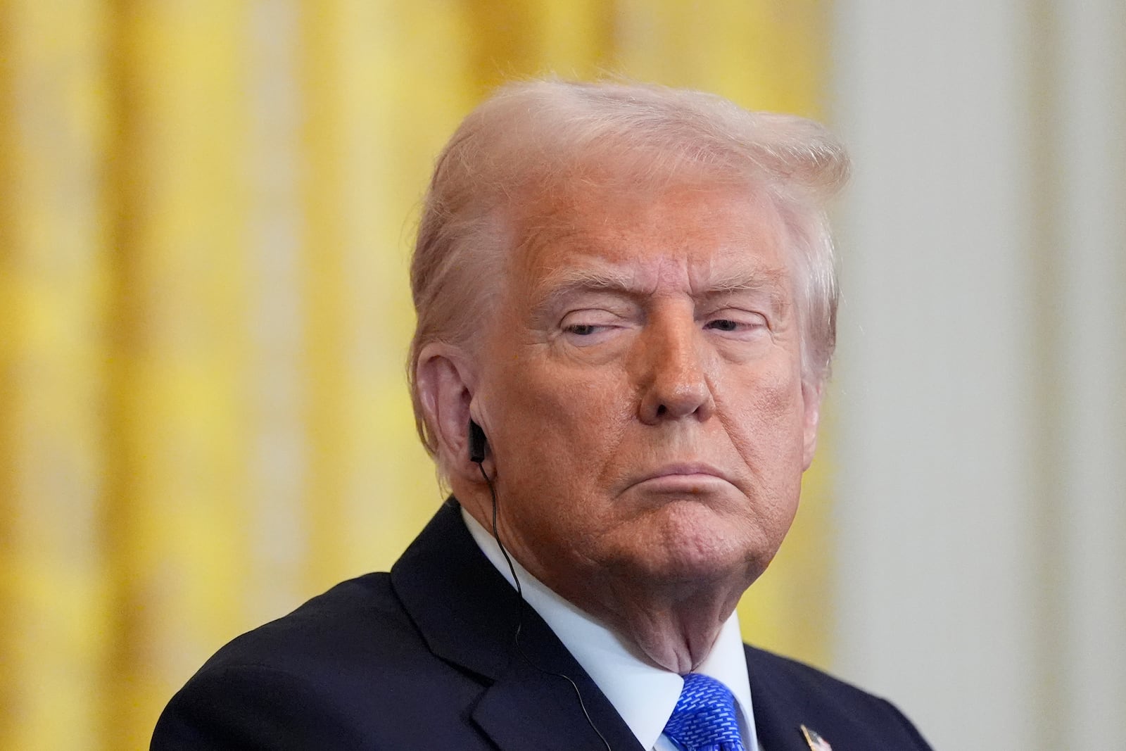 FILE - President Donald Trump listens during a news conference in the East Room of the White House, Friday, Feb. 7, 2025, in Washington. (AP Photo/Alex Brandon, File)