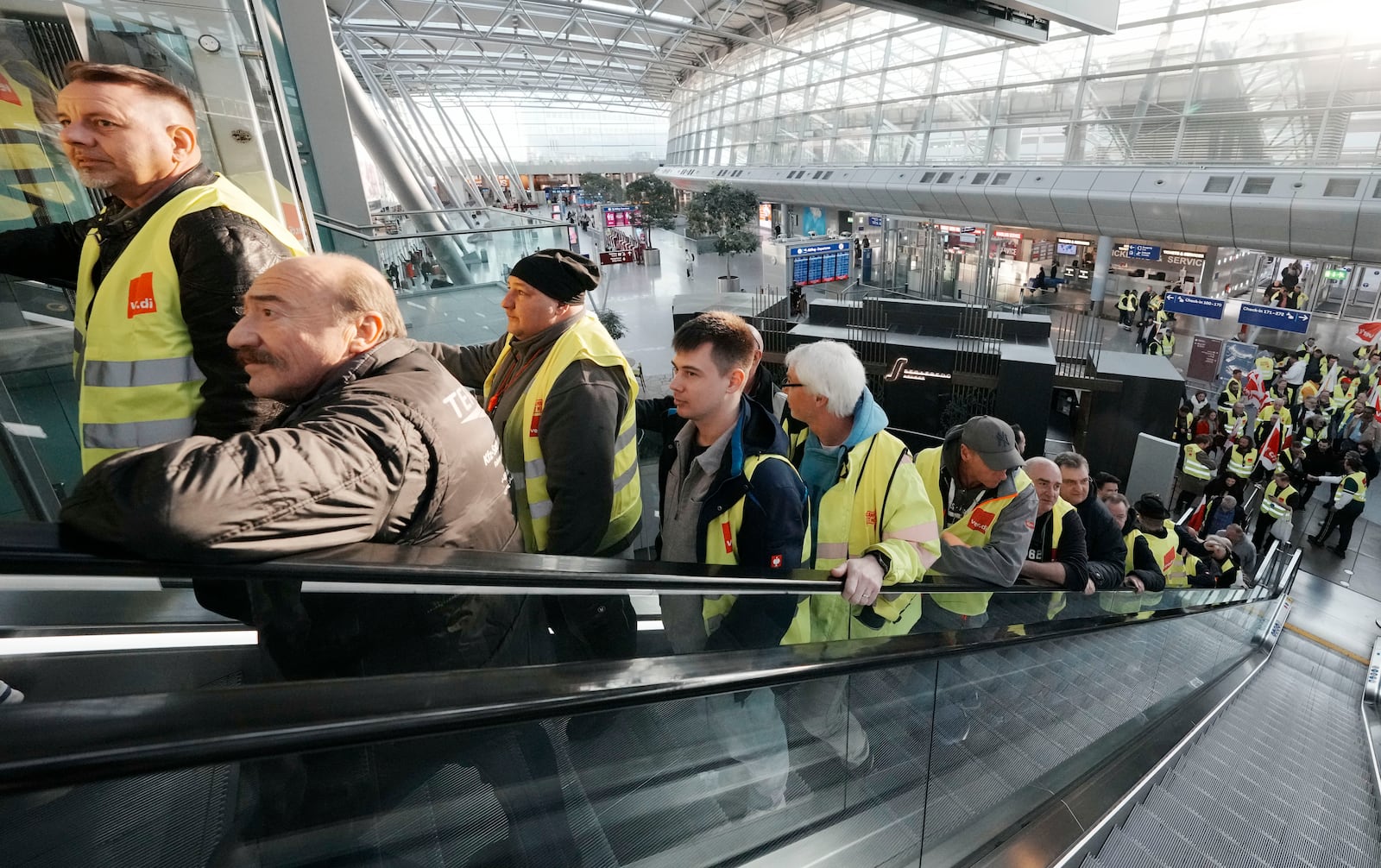 Airport workers protest during a strike of the union ver.di at the airport in Duesseldorf, Germany on Monday, March 10, 2025, when all major airports in Germany went on a warning strike. (AP Photo/Martin Meissner)