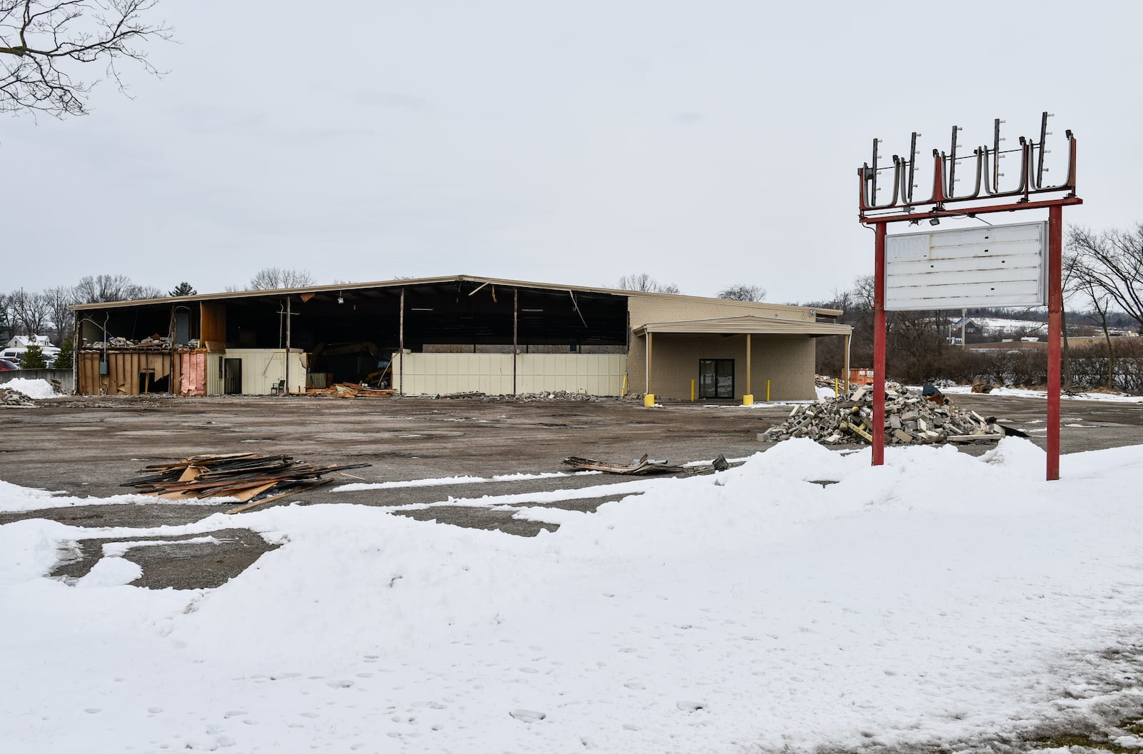 Demolition crews work to take down the Skating On Main roller skating rink Friday, Feb. 9, 2018 in Hamilton. NICK GRAHAM/STAFF