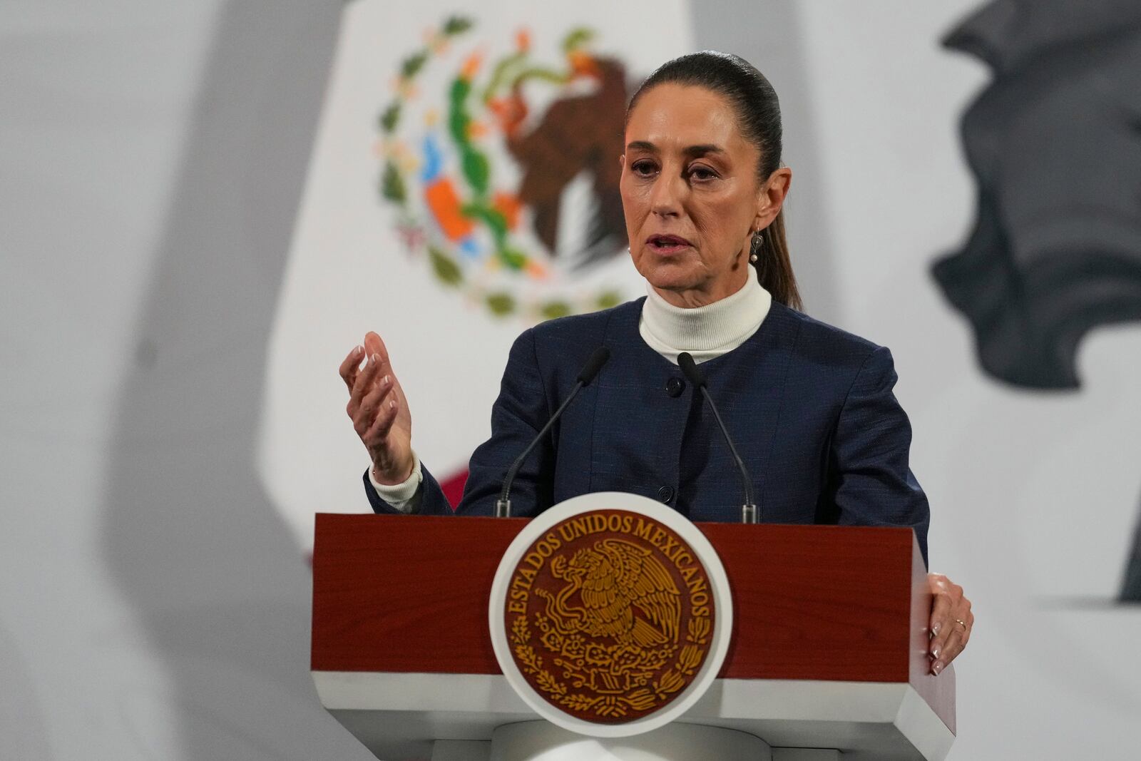 Mexican President Claudia Sheinbaum gives her daily morning press conference at the National Palace in Mexico City, Monday, Feb. 3, 2025. (AP Photo/Marco Ugarte)