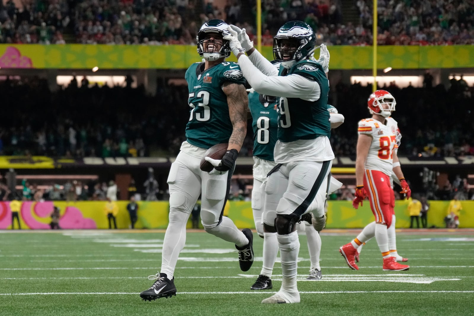 Philadelphia Eagles linebacker Zack Baun (53) celebrates with teammates after intercepting a pass during the first half of the NFL Super Bowl 59 football game against the Kansas City Chiefs, Sunday, Feb. 9, 2025, in New Orleans. Kansas City Chiefs tight end Travis Kelce (87) looks on at right. (AP Photo/George Walker IV)