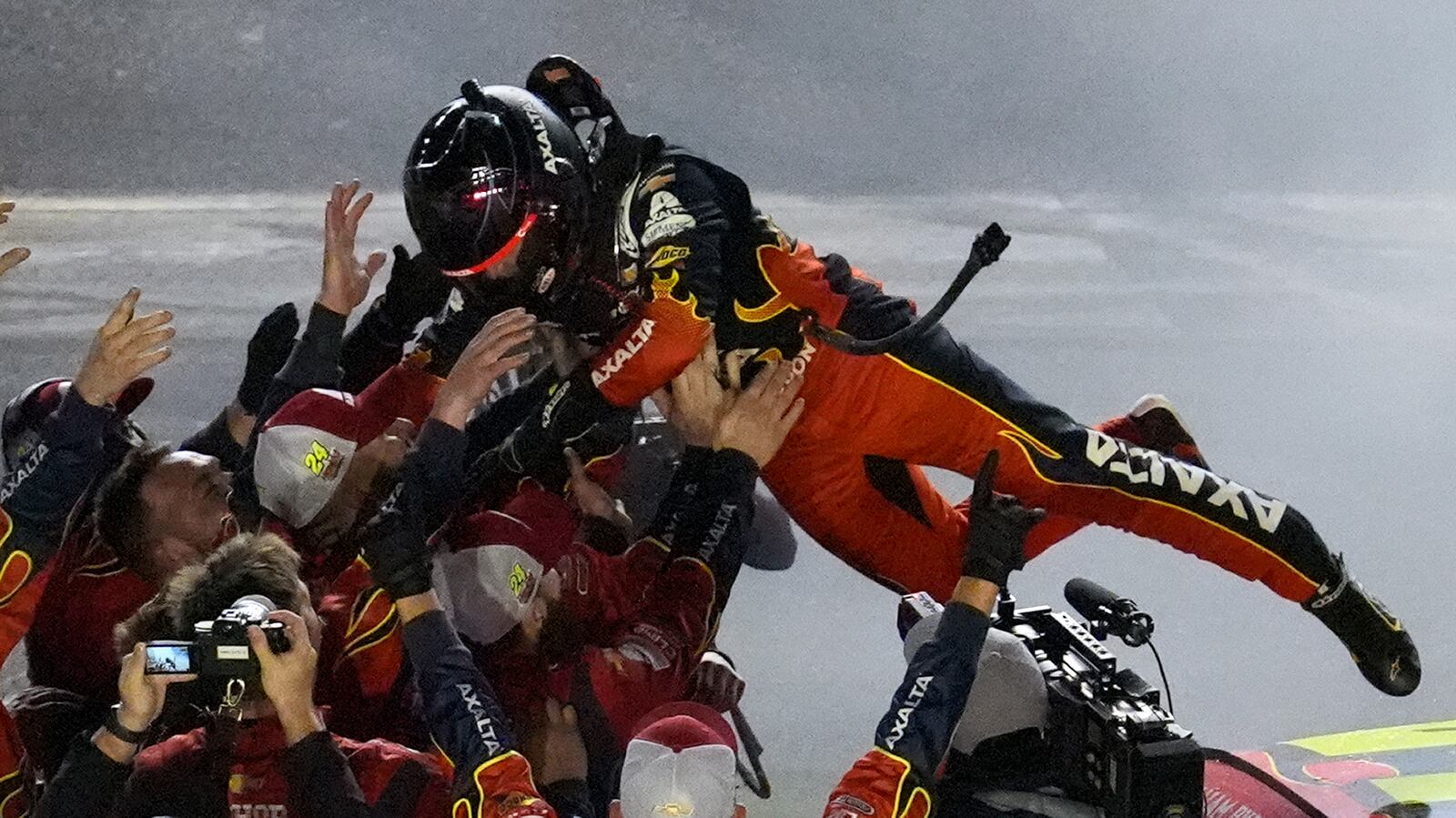 William Byron leaps into his pit cfew after winning the NASCAR Daytona 500 auto race Sunday, Feb. 16, 2025, at Daytona International Speedway in Daytona Beach, Fla. (AP Photo/Chris O'Meara)