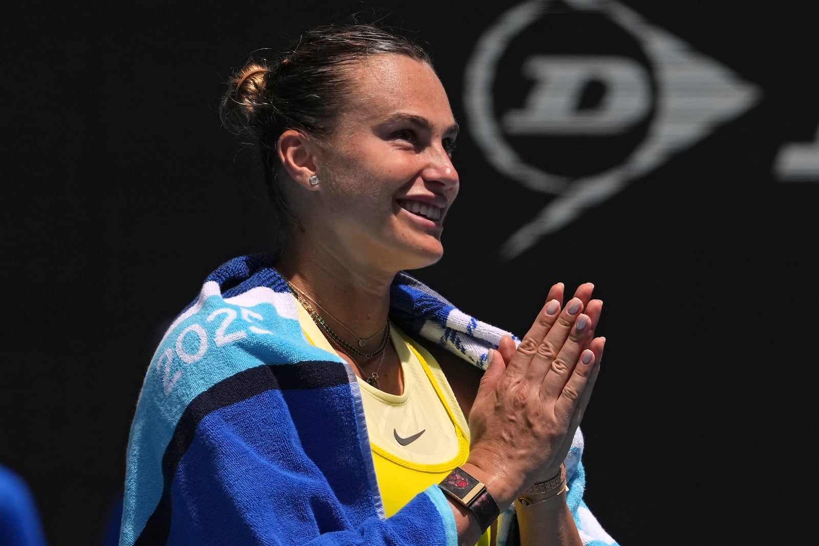 Aryna Sabalenka of Belarus reacts after defeating Mirra Andreeva of Russia during their fourth round match at the Australian Open tennis championship in Melbourne, Australia, Sunday, Jan. 19, 2025. (AP Photo/Mark Baker)