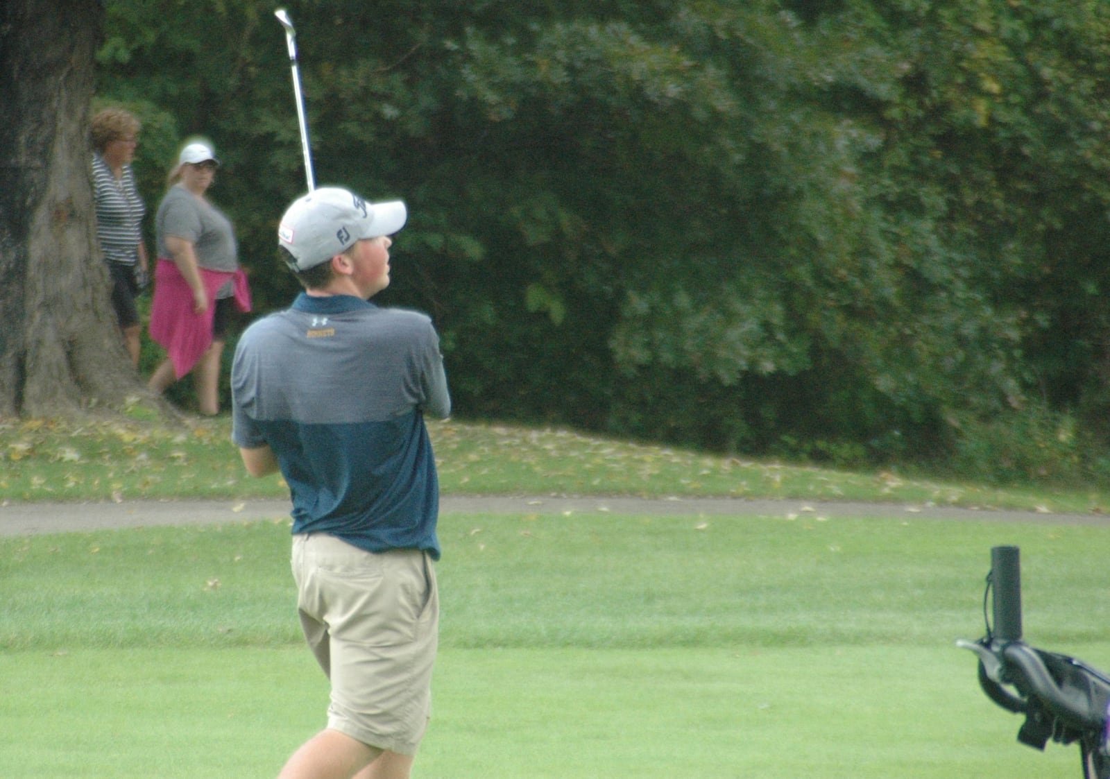 Monroe’s Alex Gomia watches one of his shots from the fairway during Wednesday’s Division I sectional boys golf tournament at Miami Whitewater Golf Course. RICK CASSANO/STAFF