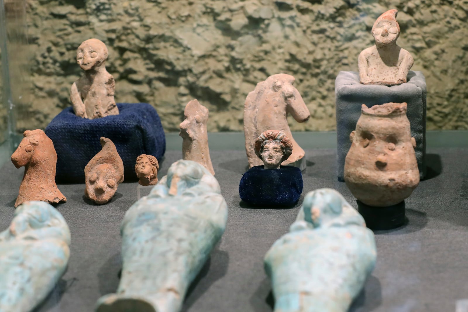 Recently unearthed artifacts by the mission of Zahi Hawass Foundation for Antiquities & Heritage on display at the causeway of Queen Hatshepsut's Funerary temple at Deir al-Bahri on the Nile's West Bank, in Luxor, Egypt, Wednesday, Jan. 8, 2025. (AP Photo/Khaled Elfiqi)