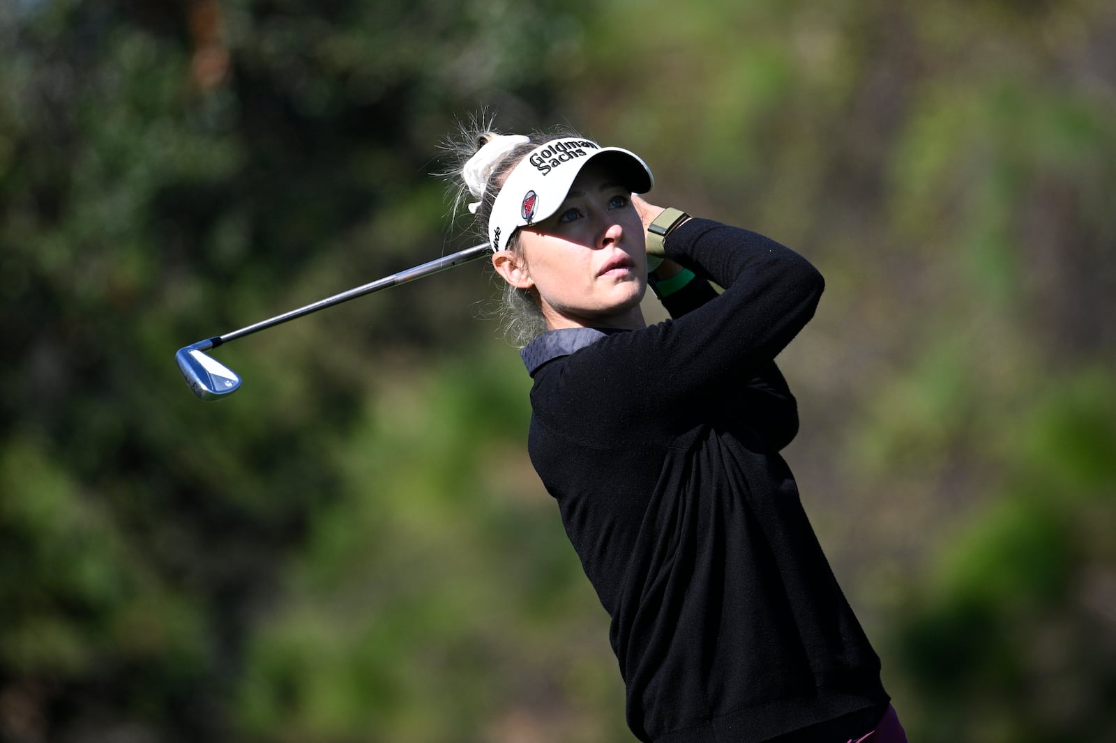 Nelly Korda watches her tee shot on the fourth hole during the first round of the PNC Championship golf tournament, Saturday, Dec. 21, 2024 in Orlando. (AP Photo/Phelan M. Ebenhack)