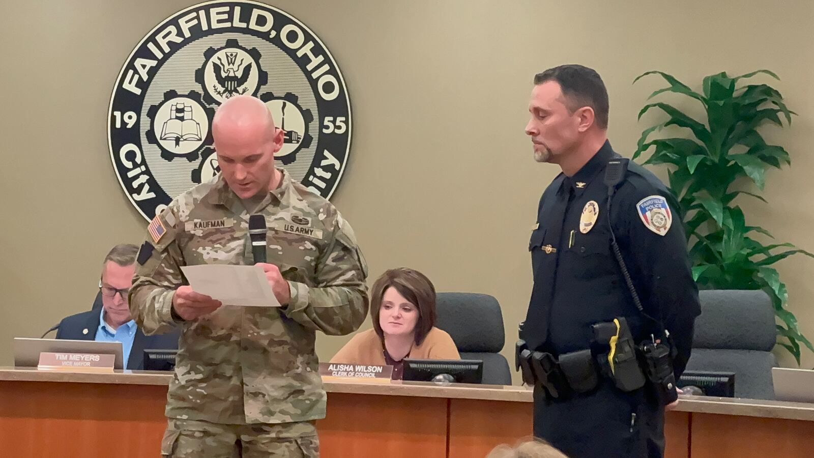 Fairfield Police Chief Steve Maynard receives the Patriot Award from Department of Defense’s Employer Support of the Guard and Reserve Award. He was nominated by Officer Trey King who is deployed overseas with his unit of the Kentucky National Guard. Sgt. First Class Matt Kaufman reads the nomination letter written by Fairfield Police Officer Trey King for the DoD's Patriot Award. MICHAEL D. PITMAN/STAFF