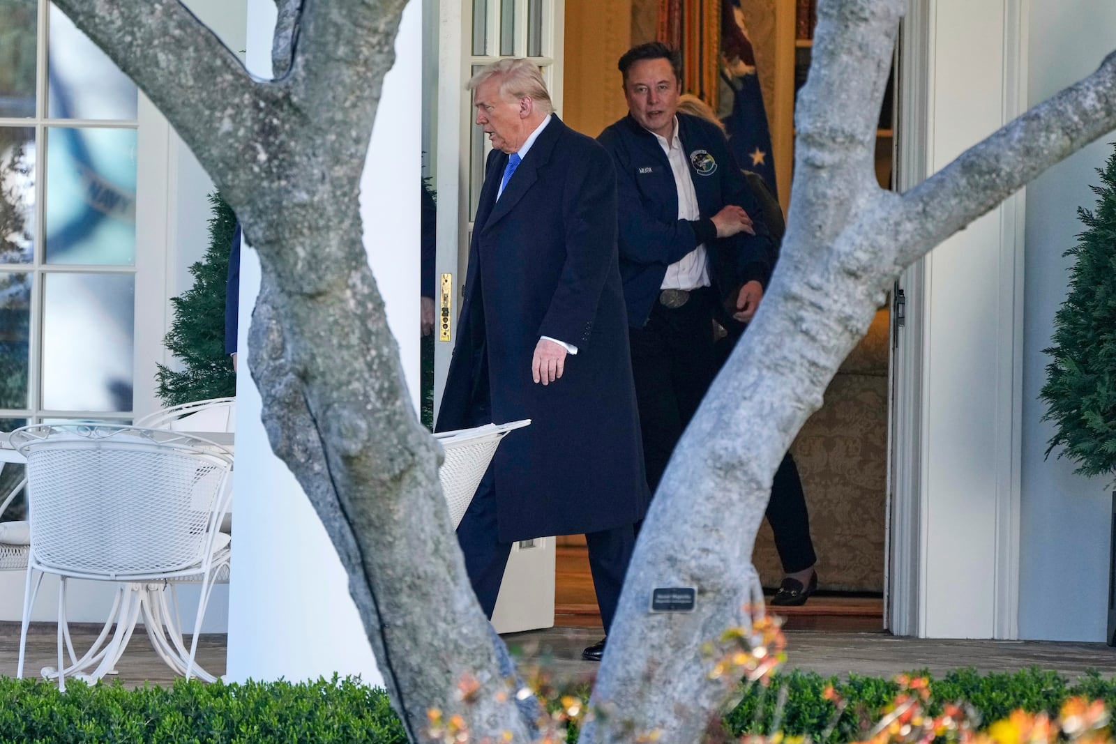 President Donald Trump, left, and Elon Musk depart the White House to board Marine One en route to New Jersey, Friday, Mar. 21, 2025, in Washington. (AP Photo/Mark Schiefelbein)