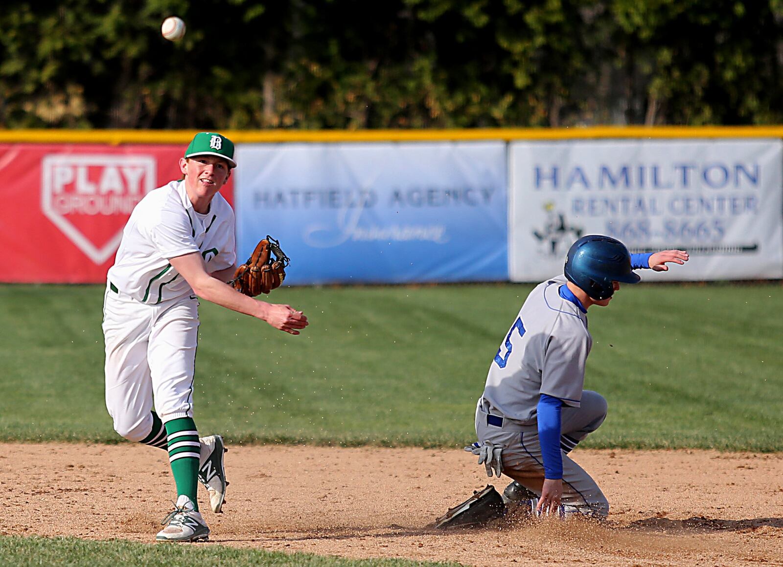 Defiance’s Jackson Meter slides into second base as Badin second baseman Drew Holderbach turns a 6-4-3 double play Wednesday at Alumni Field in Hamilton. CONTRIBUTED PHOTO BY E.L. HUBBARD