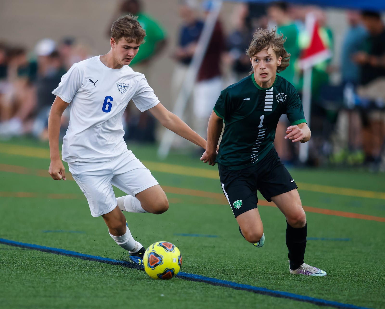 Badin's Andy Grimm (1) battles for the ball with Landmark Christian's David Lanning (6) during their soccer game on the turf field at Spooky Nook Sports Champion Mill Thursday, Aug. 25, 2022 in Hamilton. Badin won 1-0 in the first sporting events held at Spooky Nook in Hamilton. NICK GRAHAM/STAFF