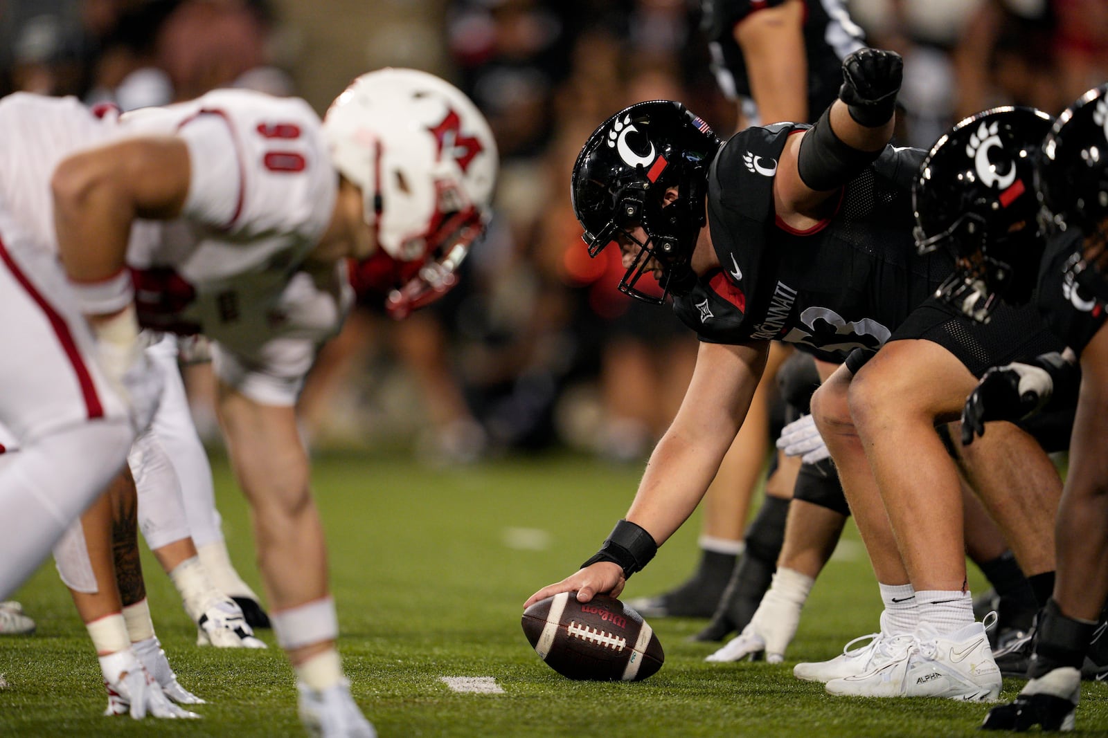 Cincinnati offensive lineman Gavin Gerhardt (53) looks to hike the ball during the first half of an NCAA college football game against Miami (Ohio), Saturday, Sept. 16, 2023, in Cincinnati. (AP Photo/Jeff Dean)