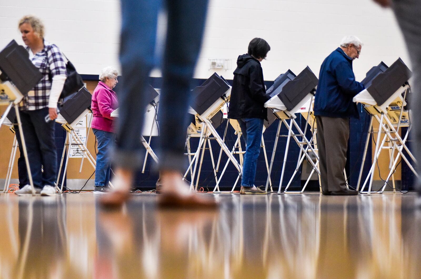 The Butler County Board of Elections is recommending the county commissioners buy an $8.1 million new voting system. The commissioners say they want more details ans some guarantees from vendors before agreeing to the purchase. Pictured are Butler County voters casting ballots in the November 2018 election. NICK GRAHAM/FILE