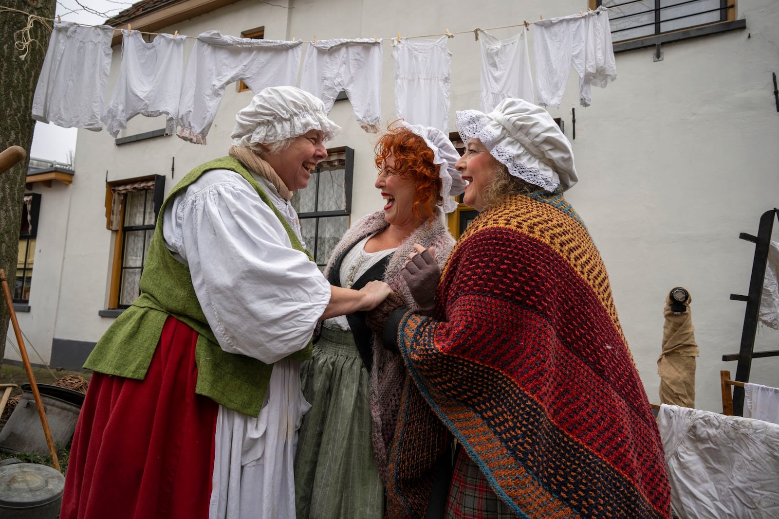 People in costumes from Charles Dickens' 19th-century English era take part in a Dickens Festival, in Deventer, Netherlands, Saturday, Dec. 14, 2024. (AP Photo/Peter Dejong)