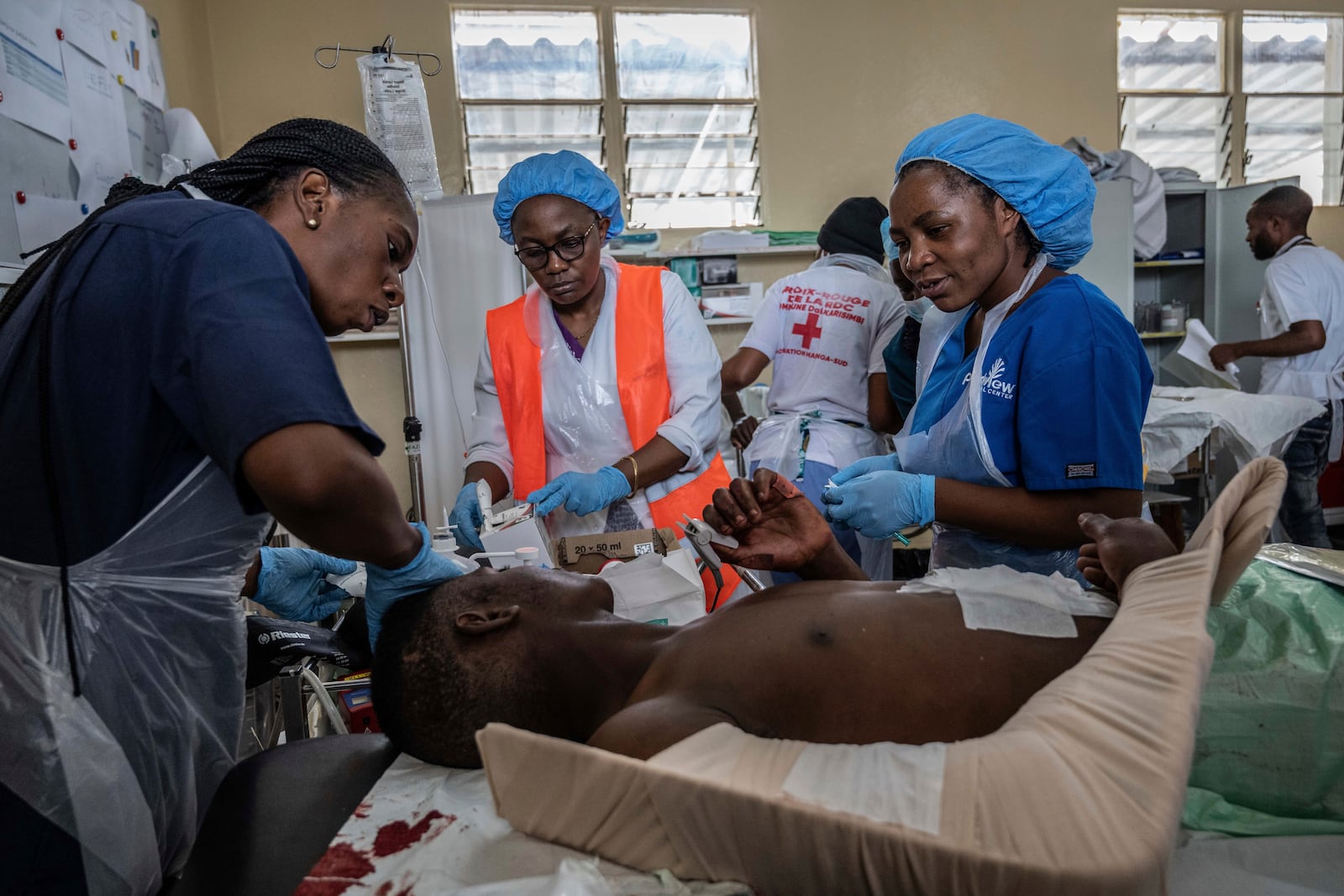 People wounded in the fighting between M23 rebels and Congolese armed forces arrive at the Cbeca Ndosho hospital in Goma, Democratic Republic of the Congo, Thursday, Jan. 23, 2025. (AP Photo/Moses Sawasawa)