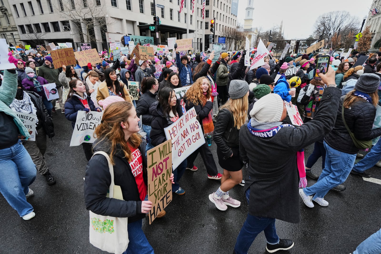 People participate in the People's March, Saturday, Jan. 18, 2025, in Washington. (AP Photo/Julio Cortez)