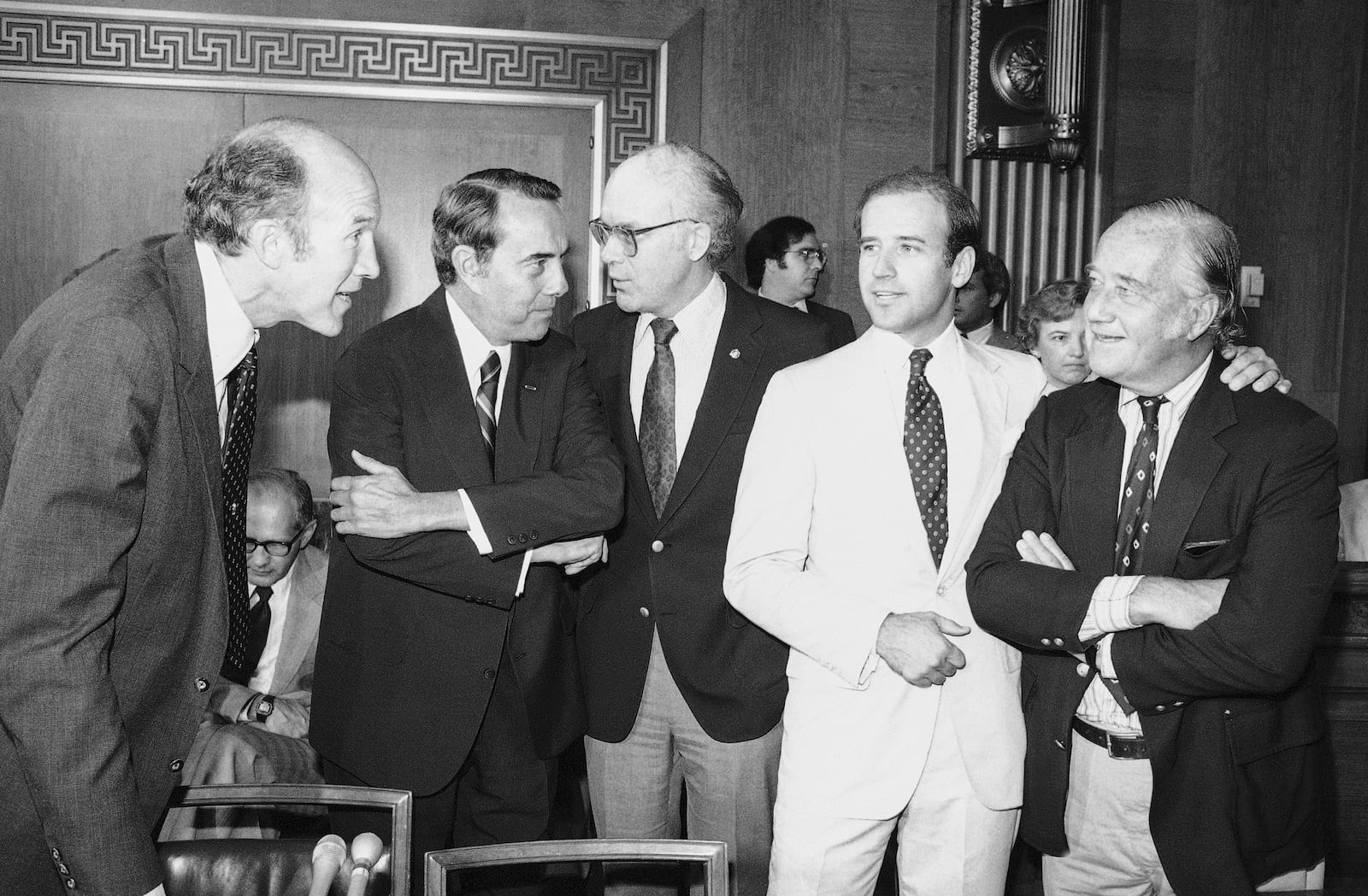 FILE - Members of the Senate Judiciary Committee confer prior to voting to recommend the nomination of Supreme Court nominee Sandra Day O'Connor, to the full Senate for confirmation, Sept. 15, 1981, Washington. From left, Sen. Alan Simpson, R-Wyo., Sen. Robert Dole, R-Kan., Sen. Patrick Leahy, D-Vt., and Sen. Joseph Biden, D-Del., second from right. Biden knows better than anyone the unexpected turns a Supreme Court nomination can take after it lands on Capitol Hill. Simpson has died at age 93. (AP Photo/Ira Schwarz, File)