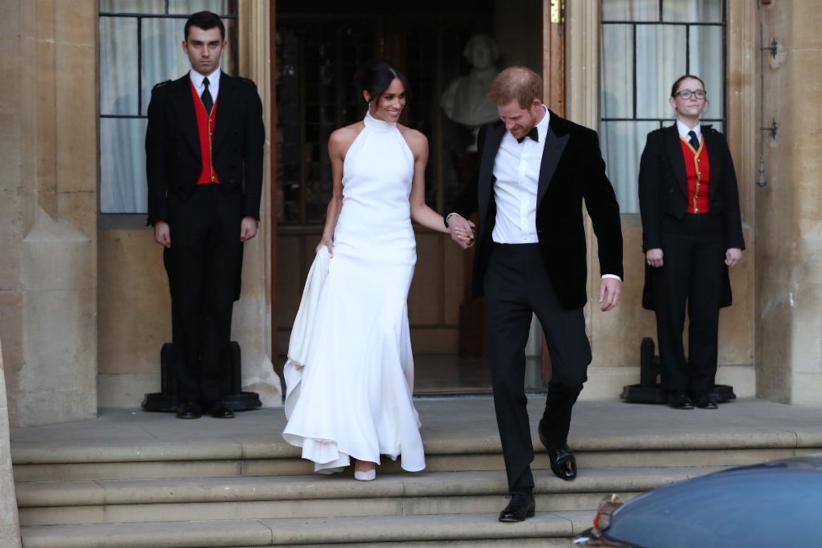 WINDSOR, UNITED KINGDOM - MAY 19: Duchess of Sussex and Prince Harry, Duke of Sussex leave Windsor Castle after their wedding to attend an evening reception at Frogmore House, hosted by the Prince of Wales on May 19, 2018 in Windsor, England. (Photo by Steve Parsons - WPA Pool/Getty Images)