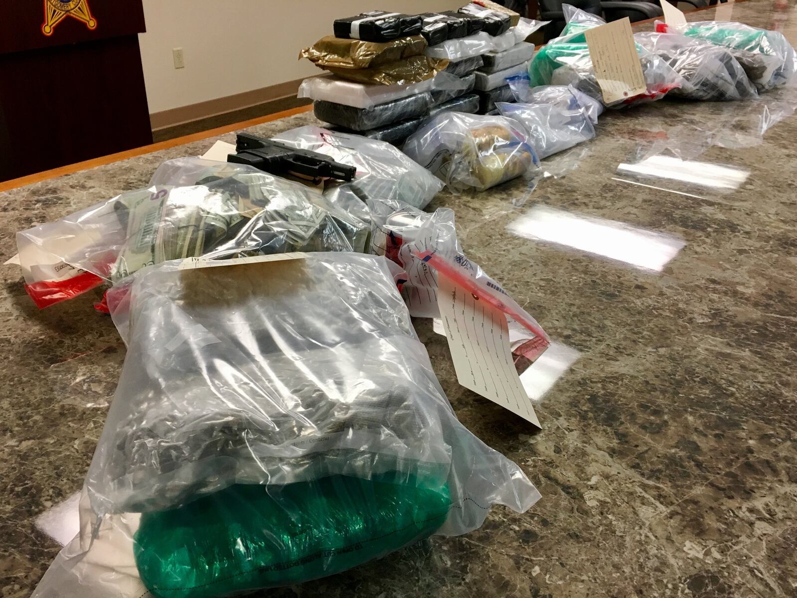 A Montgomery County task force recovered drugs, cash and a weapon during an operation this week that netted four arrests and 44 pounds of fentanyl. STAFF/MARK GOKAVI