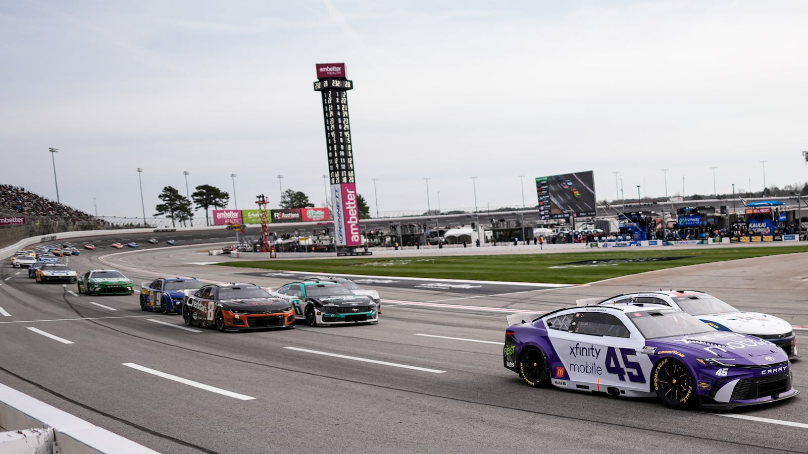 Tyler Reddick (45) pulls out of Turn 4 during a NASCAR Cup Series auto race, Sunday, Feb. 23, 2025, in Hampton, Ga. (AP Photo/Mike Stewart)