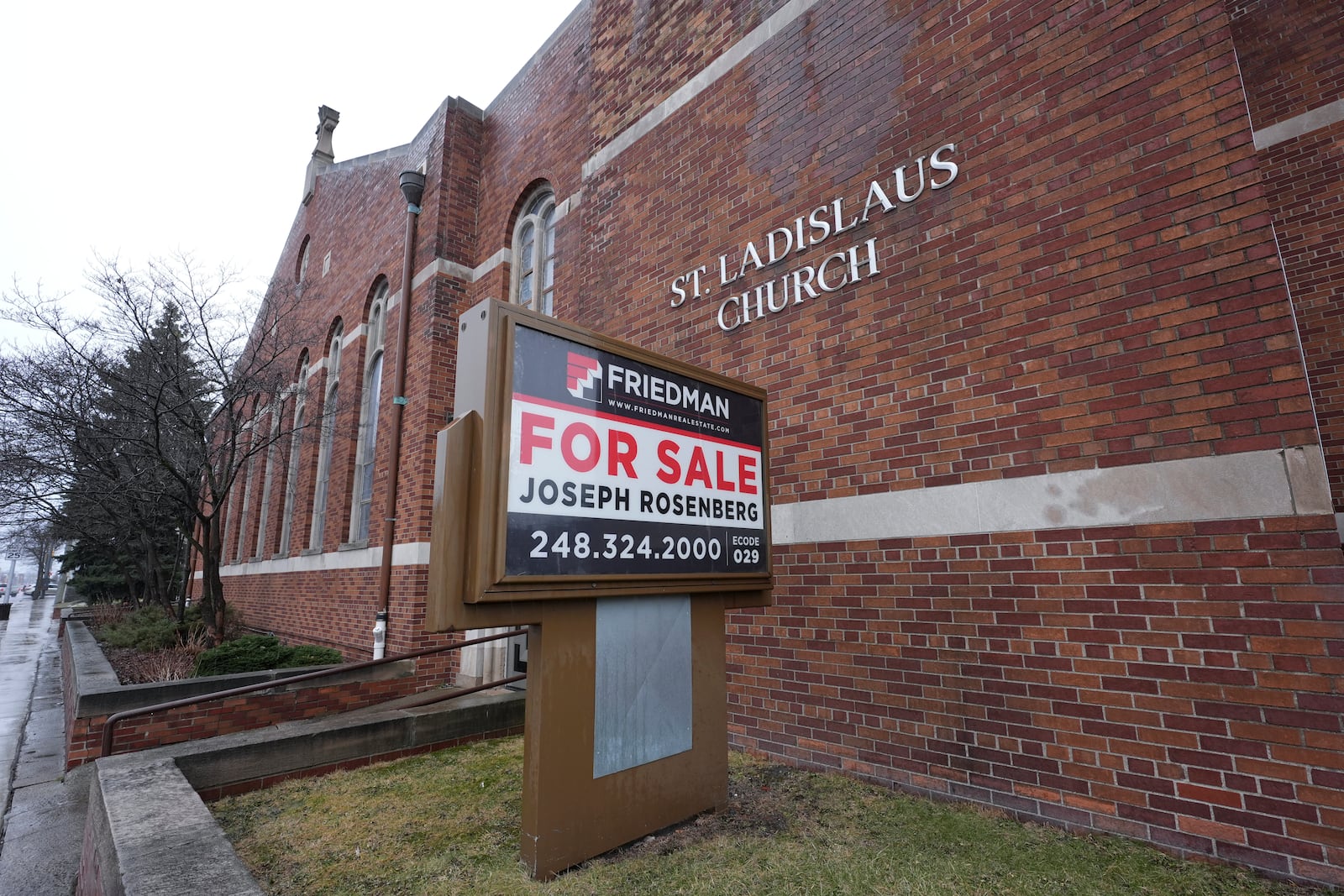 A "for sale" sign is shown at St. Ladyslaus Church, Friday, Jan. 31, 2025, in Hamtramck, Mich. (AP Photo/Paul Sancya)