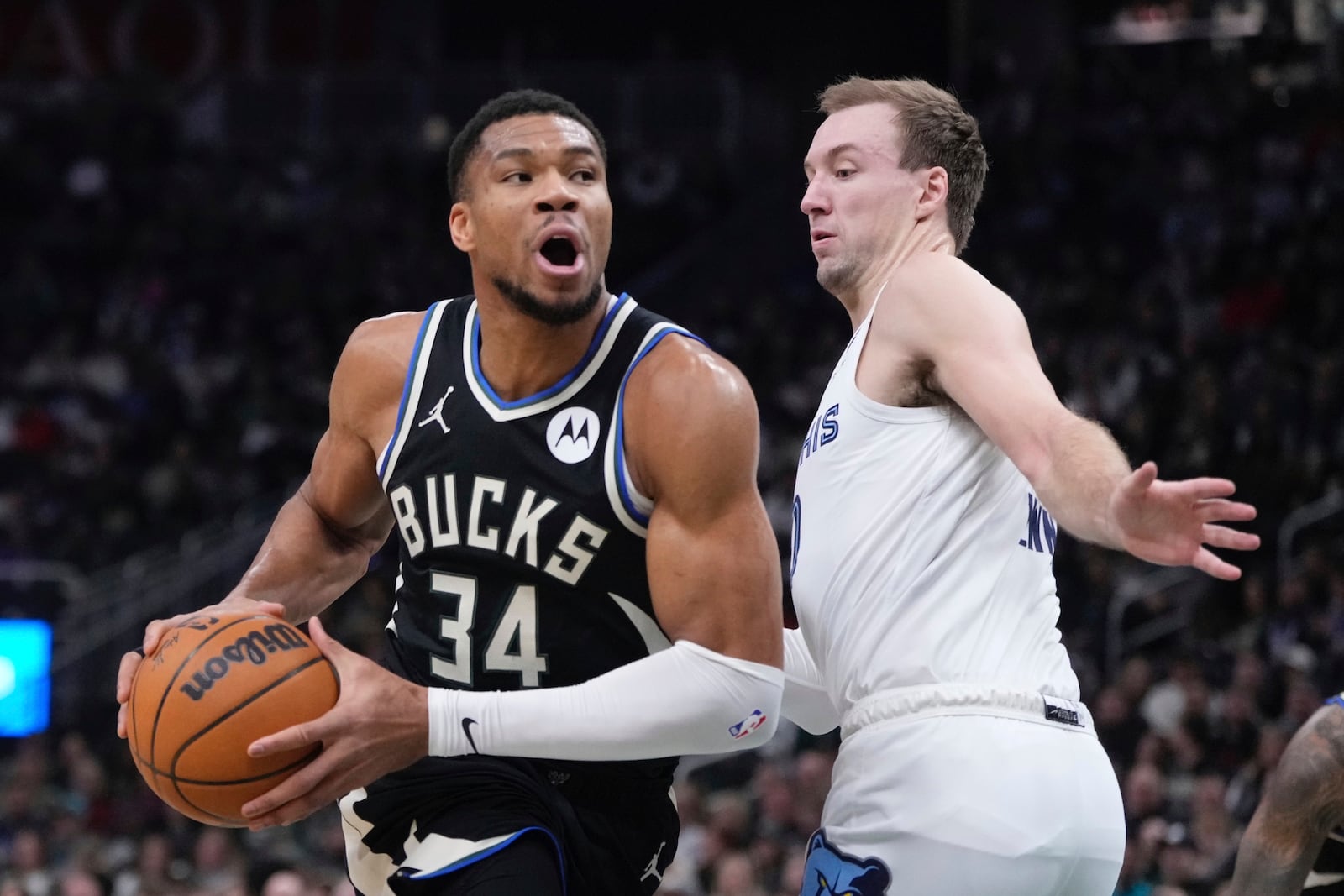 Milwaukee Bucks' Giannis Antetokounmpo tries to get past Memphis Grizzlies' Luke Kennard during the first half of an NBA basketball game Sunday, Feb. 2, 2025, in Milwaukee. (AP Photo/Morry Gash)