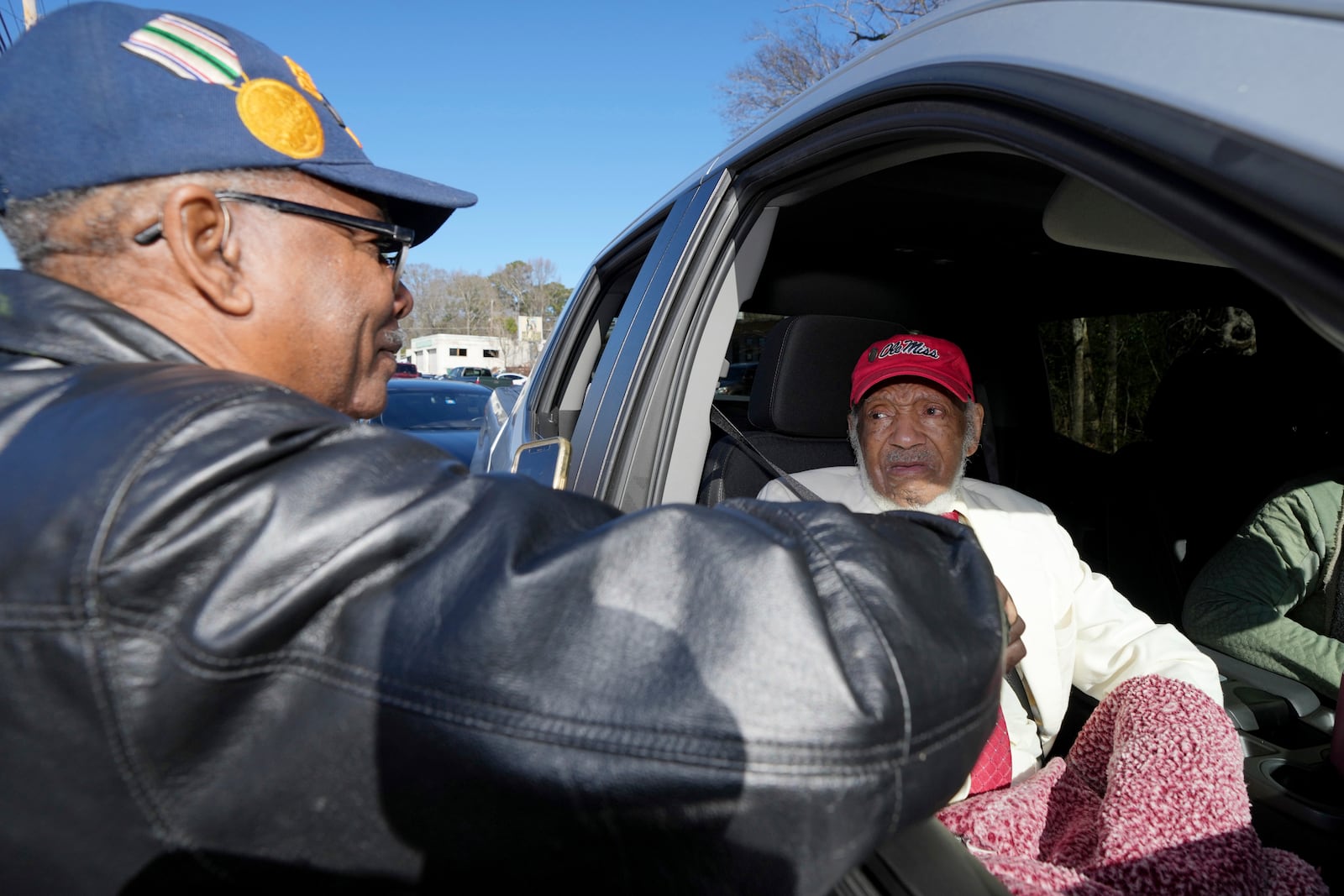 George Smith, left, congratulates James Meredith, who became the first Black student to enroll at the University of Mississippi in 1962, on being honored with a Mississippi Department of Archives and History marker recognizing his birthplace and his legacy in the Civil Rights Movement, Friday, Dec. 20, 2024, in Kosciusko, Miss.(AP Photo/Rogelio V. Solis)