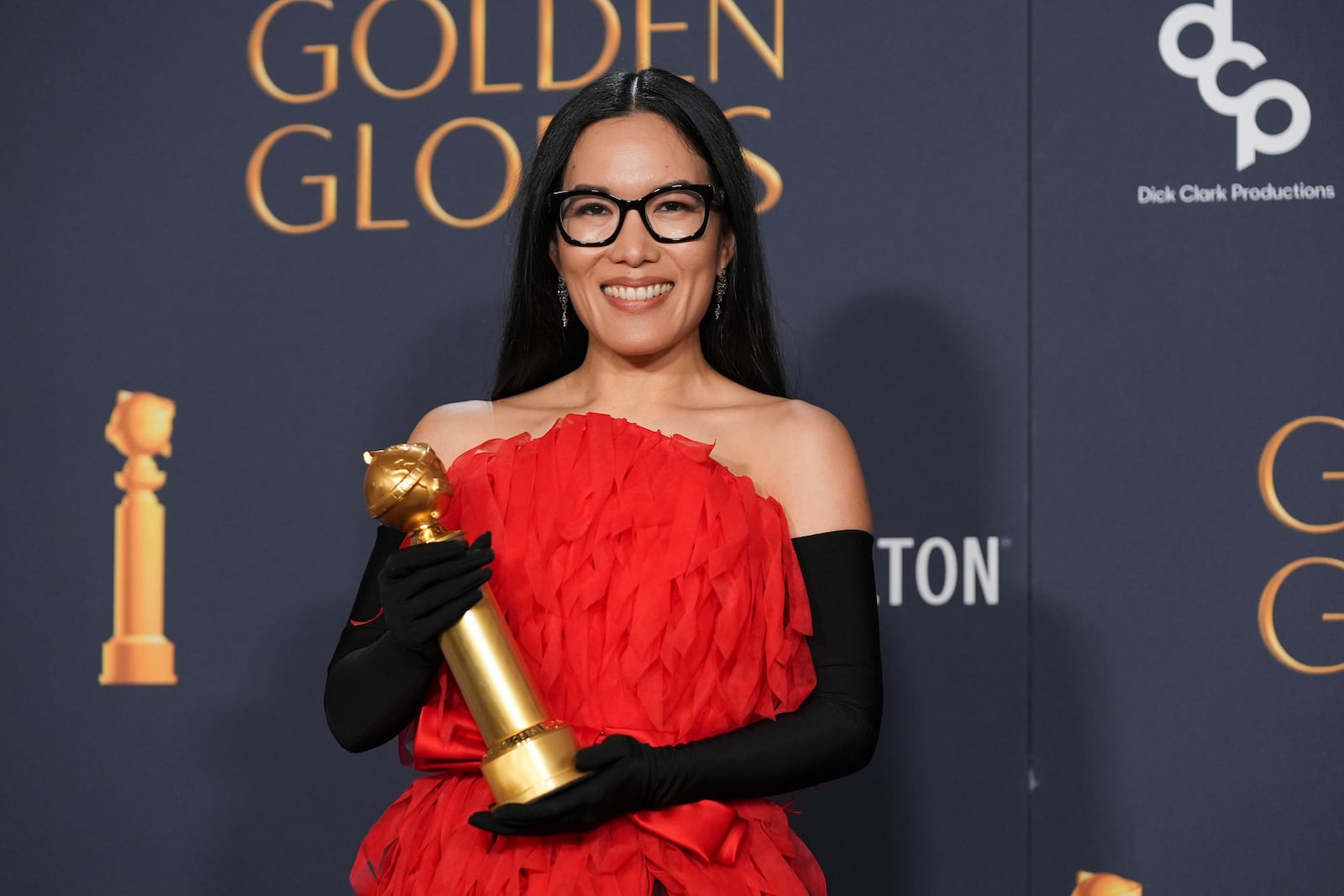 Ali Wong poses in the press room with the award for best performance in stand-up comedy on television for "Ali Wong: Single Lady" during the 82nd Golden Globes on Sunday, Jan. 5, 2025, at the Beverly Hilton in Beverly Hills, Calif. (AP Photo/Chris Pizzello)