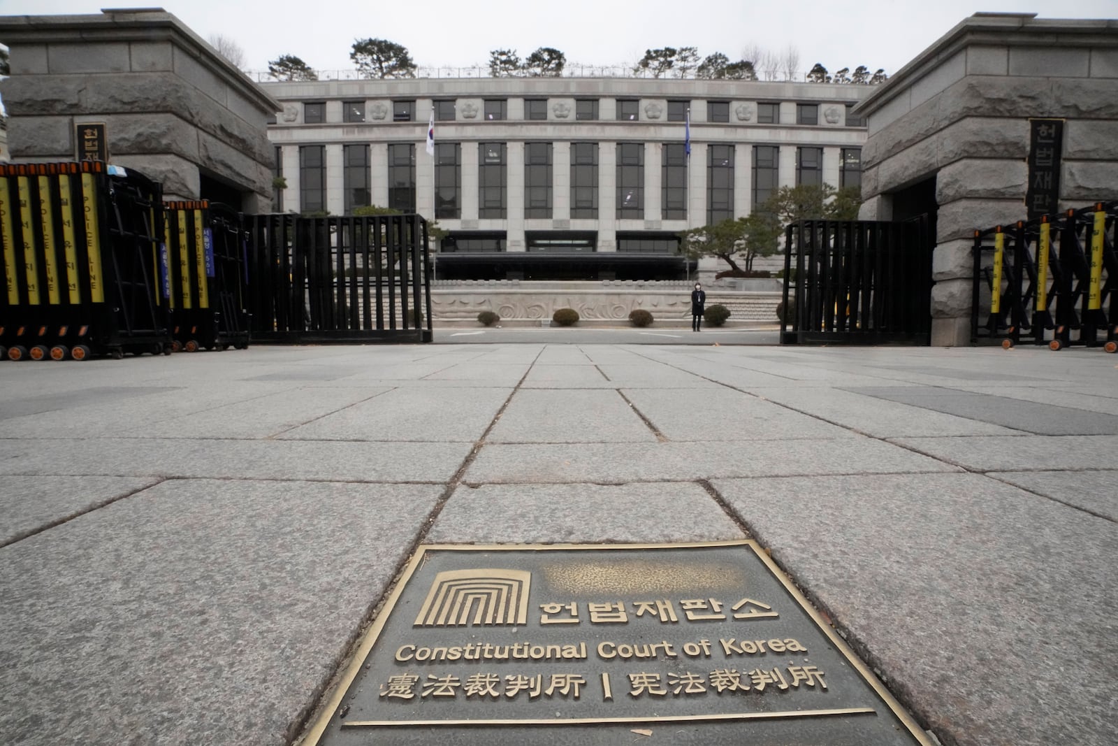 A sign of the Constitutional Court is seen on the ground in front of the court's building in Seoul, South Korea, Monday, Dec. 16, 2024. (AP Photo/Ahn Young-joon)