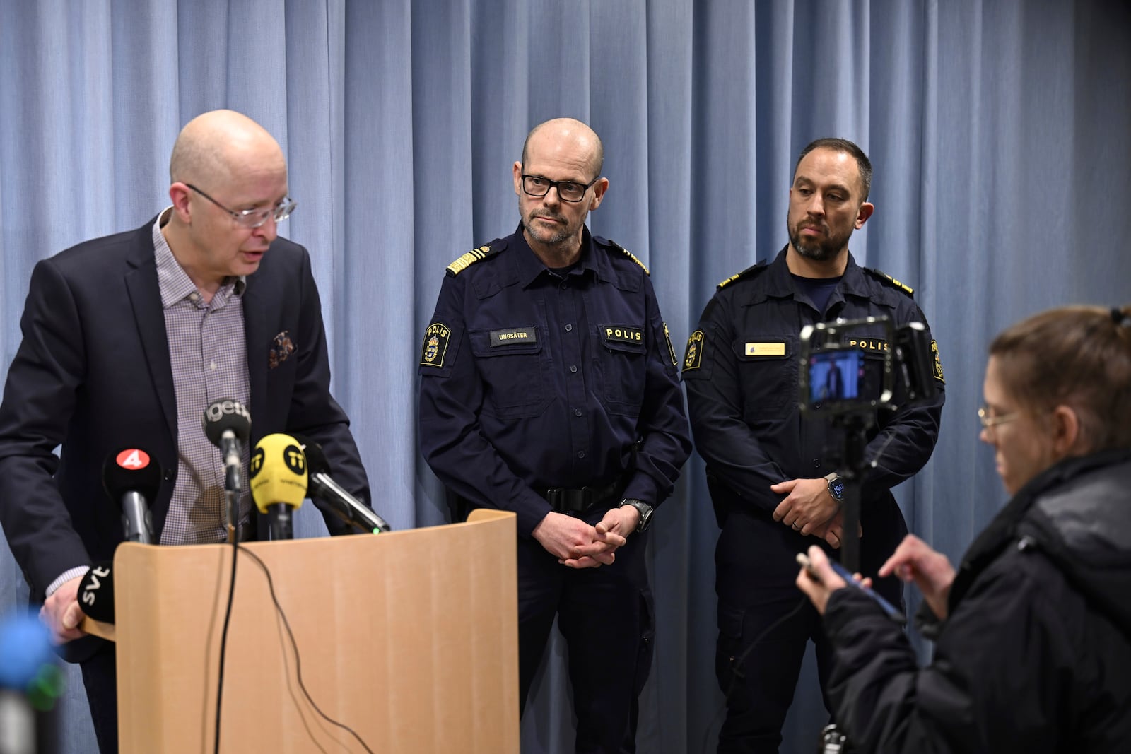 From left, Jonas Claesson, Director of Health and Medical Services in Region Örebro County, Patrick Ungsäter, Regional Police Chief and Roberto Eid Forest, Chief of Local Police Area Örebro take part in a press conference after five people were shot at the adult education center campus at Risbergska school, in Örebro, Sweden, Tuesday, Feb. 4, 2025. (Pontus Lundahl/TT News Agency via AP)