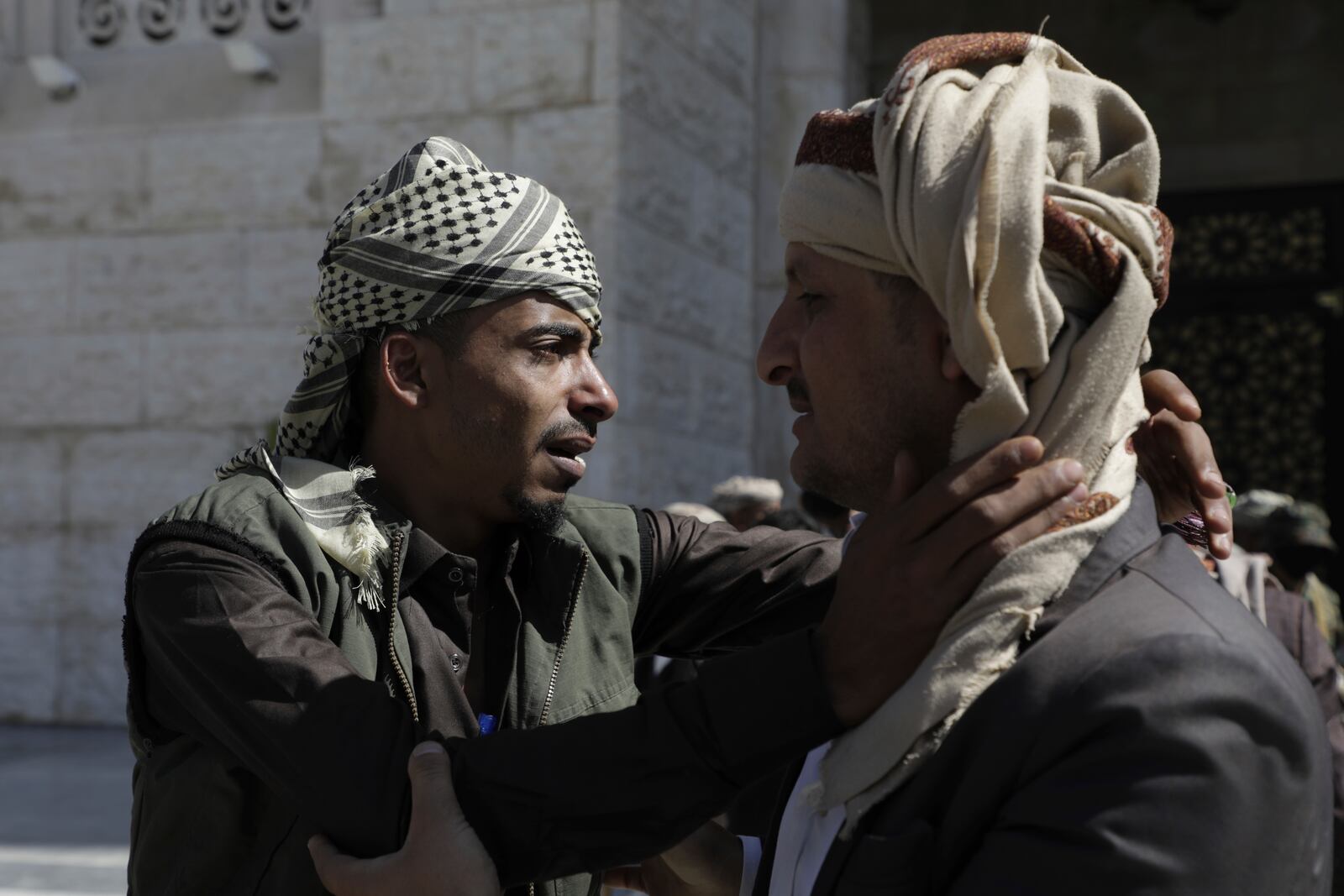 A prisoner detained by the Houthis is greeted by his father after his release, in Sanaa, Yemen, Saturday, Jan. 25, 2025. (AP Photo/Osamah Abdulrahman)