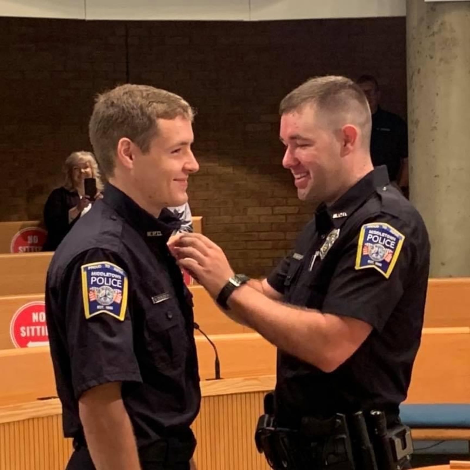 Brian Singleton, 23, left, recently was pinned by his brother, Josh Singleton, 29, as Brian joined his brother on the Middletown Division of Police force. SUBMITTED PHOTO