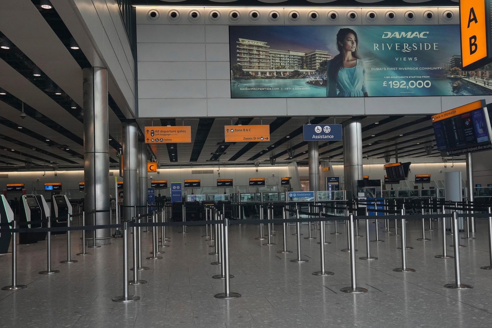 No travellers are seen inside Terminal 4 as Britain's Heathrow Airport has closed for the full day Friday after an electrical substation fire knocked out its power, disrupting flights for hundreds of thousands of passengers at one of Europe's biggest travel hubs in London, Friday, March 21, 2025.(AP Photo/Kin Cheung)