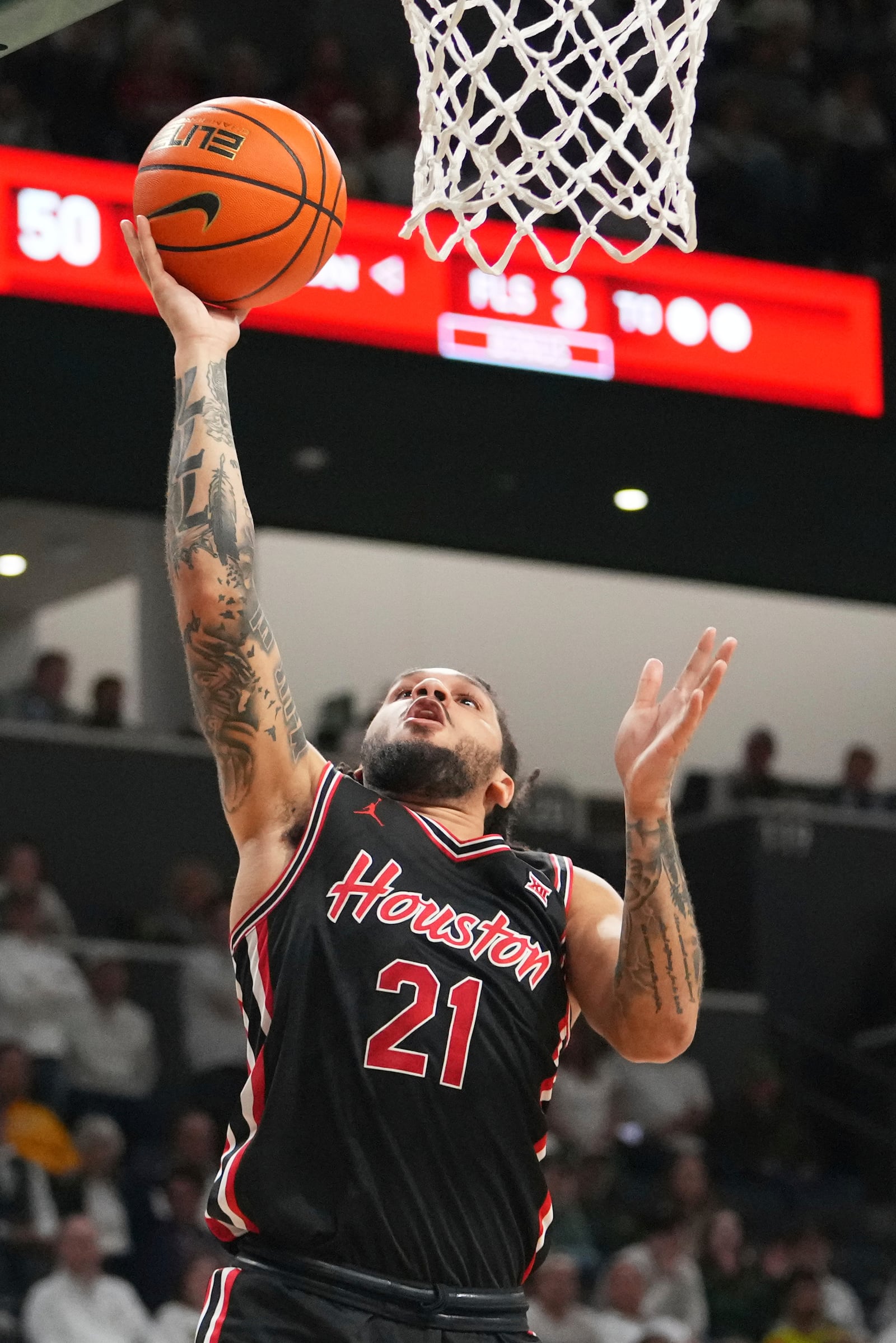 Houston guard Emanuel Sharp goes up for a basket against the Baylor during the second half of an NCAA college basketball game Saturday, March 8, 2025, in Waco, Texas. (AP Photo/Julio Cortez)