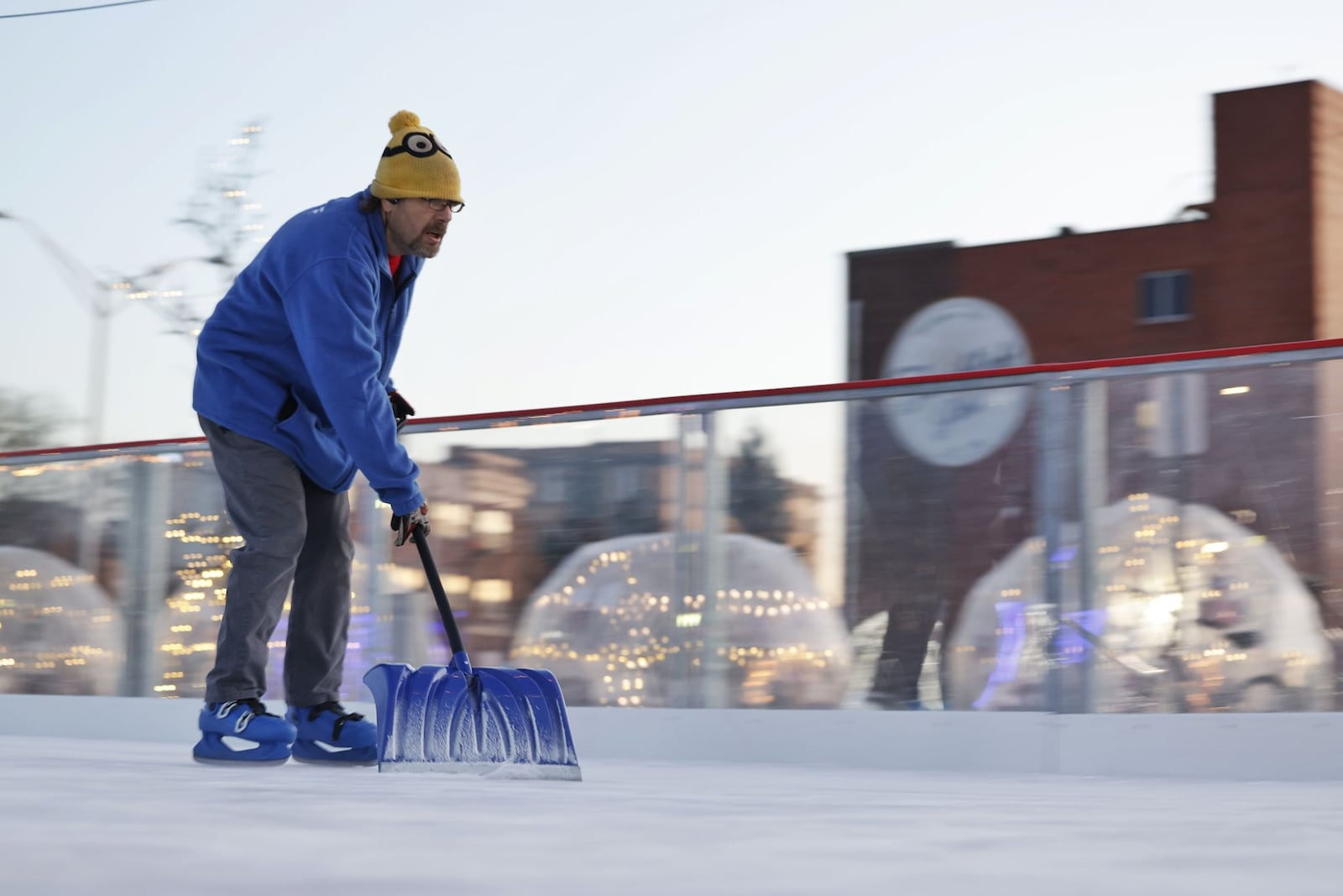 Worker Samuel Marriott scrapes the ice at the Middletown Holiday Whopla ice skating rink Wednesday, Dec. 13, 2023 in downtown Middletown. NICK GRAHAM/STAFF