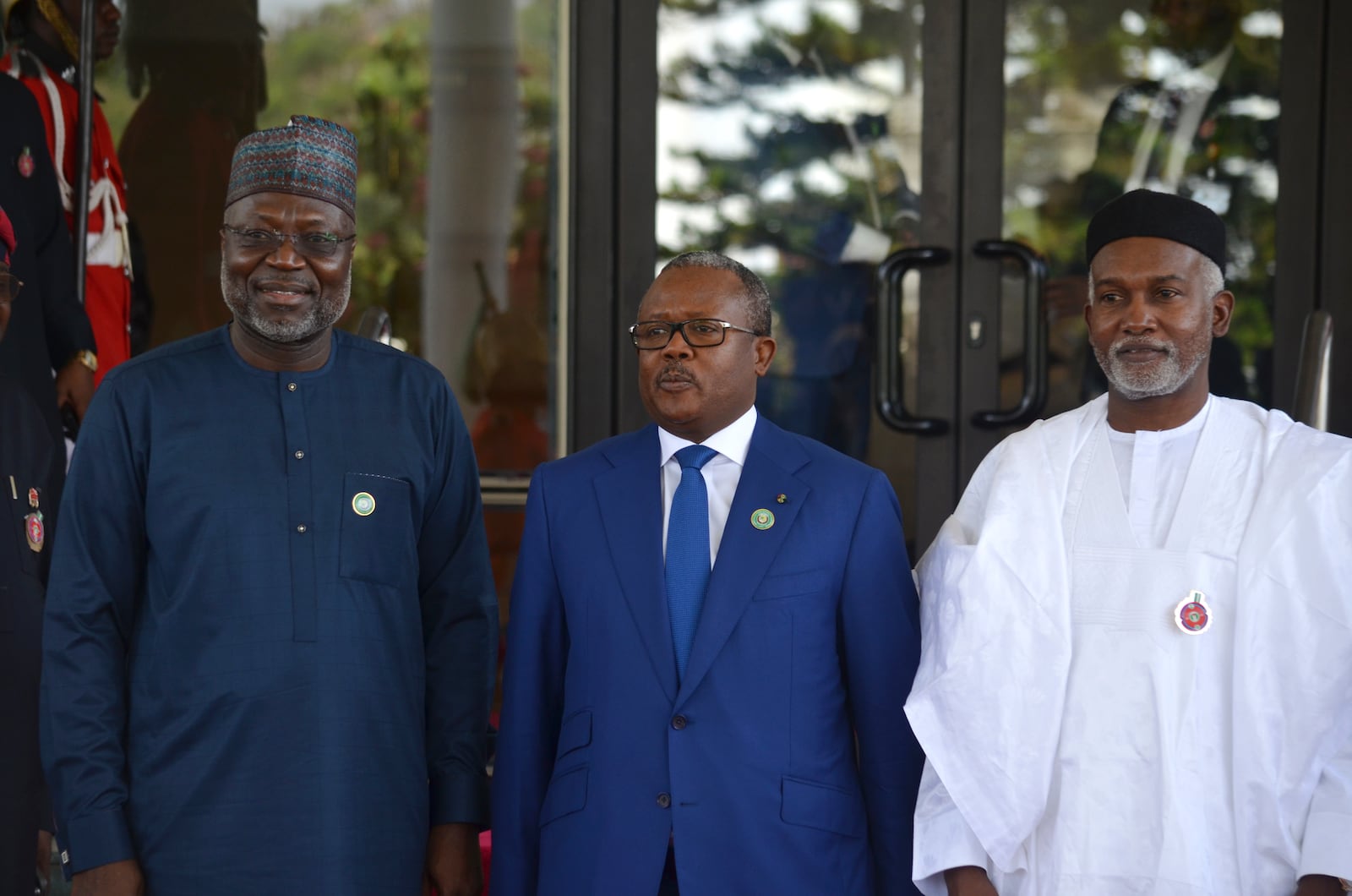 Omar Touray, president of the ECOWAS Commission, left, Guninea Bissau President Umaro Sissoco Embalo, center and Nigeria Minister of Foreign Affairs, Yusuf Tuggar pose for a photo, prior to the start of the ECOWAS meeting in Abuja, Nigeria, Sunday, Dec 15, 2024. (AP Photo/Olamikan Gbemiga)