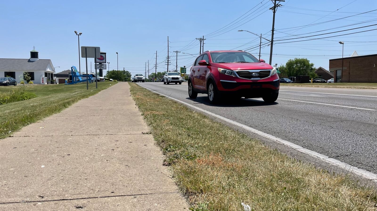 The city of Hamilton is applying for a federal Transportation Alternatives program grant through OKI for a sidewalk project along Main Street and NW Washington Boulevard. Pictured is traffic in the 1300 block of Main Street where there the existing sidewalk ends in front of Texas Roadhouse. If awarded, the project would connect gaps of sidewalk. However, the project wouldn’t take place until federal fiscal year 2027. MICHAEL D. PITMAN/STAFF