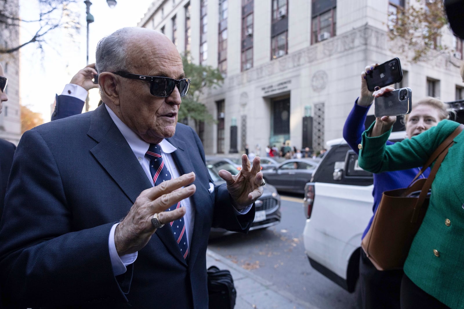 Former New York City Mayor Rudy Giuliani arrives at the court to explain to a federal judge why he hasn't surrendered his valuables as part of a $148 million defamation judgment, in New York, Thursday, Nov. 7, 2024. (AP Photo/Yuki Iwamura)