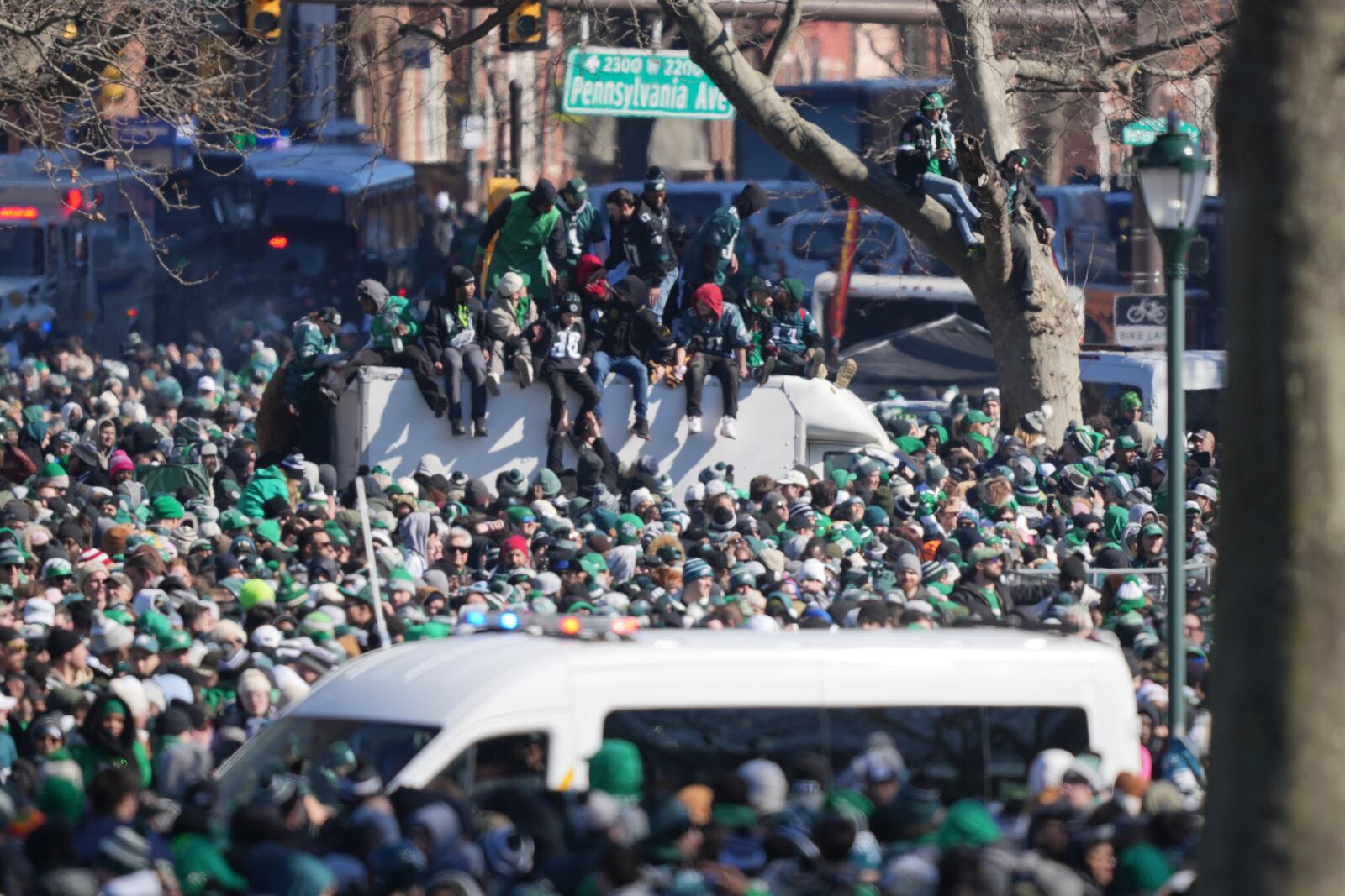 Fans climb atop a box truck to get a better view during the Philadelphia Eagles NFL football Super Bowl 59 parade and celebration, Friday, Feb. 14, 2025, in Philadelphia. (AP Photo/Matt Rourke)