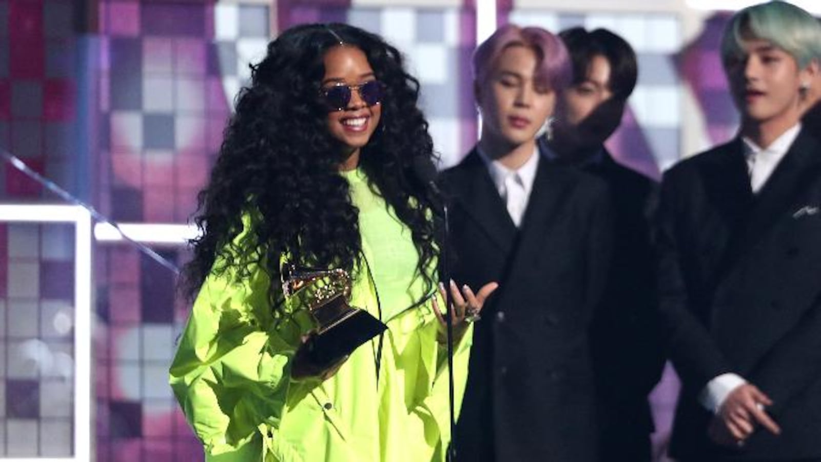 H.E.R. accepts the award for best R&B album for "H.E.R." at the 61st annual Grammy Awards on Sunday, Feb. 10, 2019, in Los Angeles.